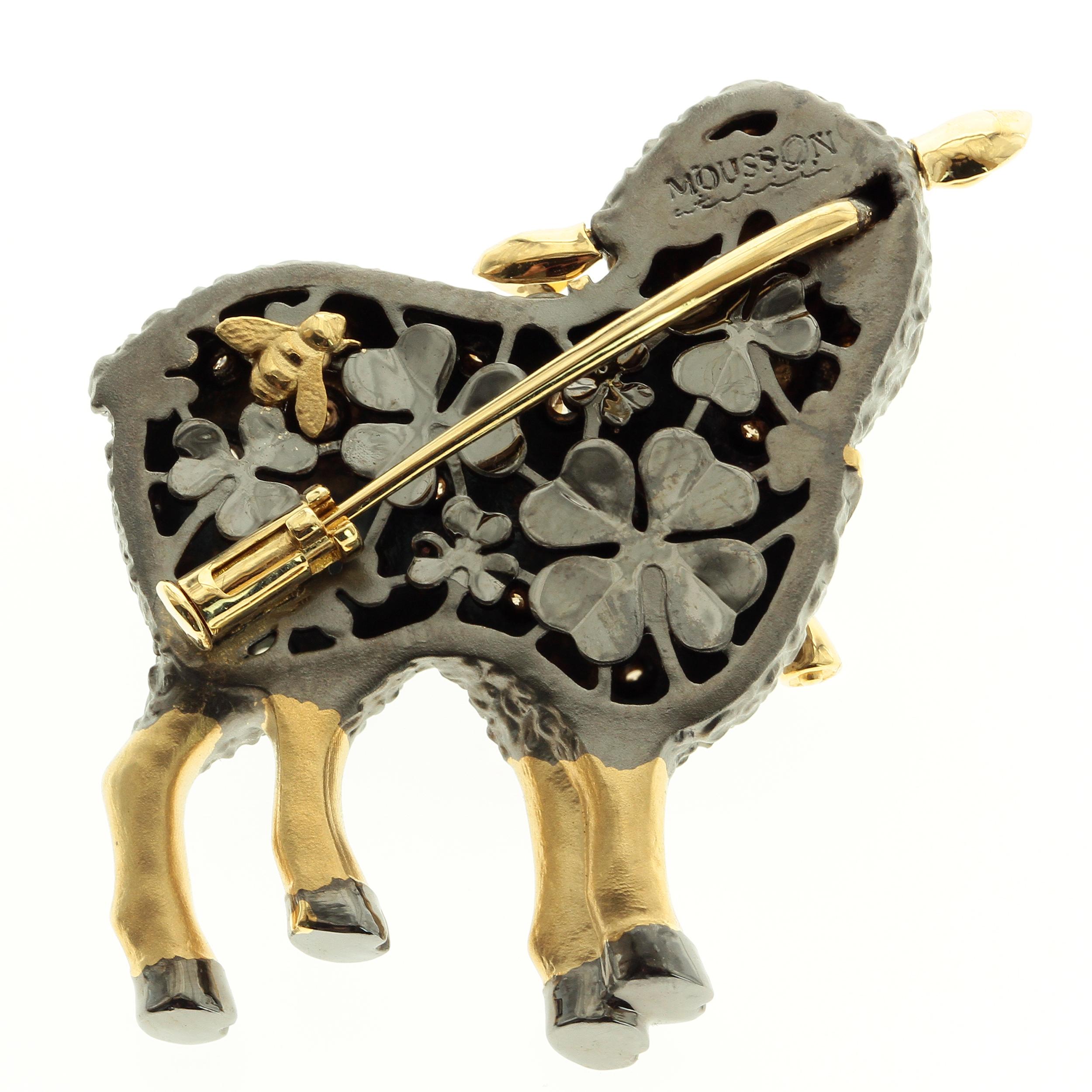 Diamond 18 Karat Yellow Black Gold Sheep Brooch
On the backside, you will find the clоver field and the Bee. The ears and neck bell are dangling.

33mm x 31mm x 9mm
15.81 gms
