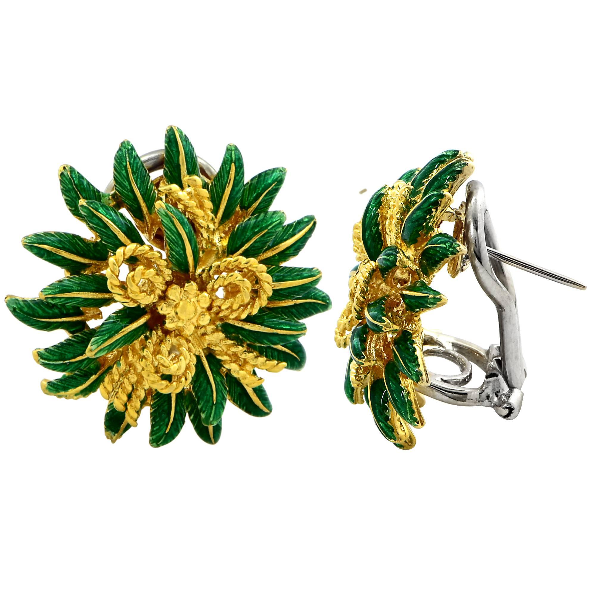 Beautifully crafted 18k yellow gold and enamel flower and twisted rope motif earrings. These earrings feature layers of vibrant green enamel petals intricately intertwined with twisted 18k yellow gold rope, culminating in a beautifully crafted bow.