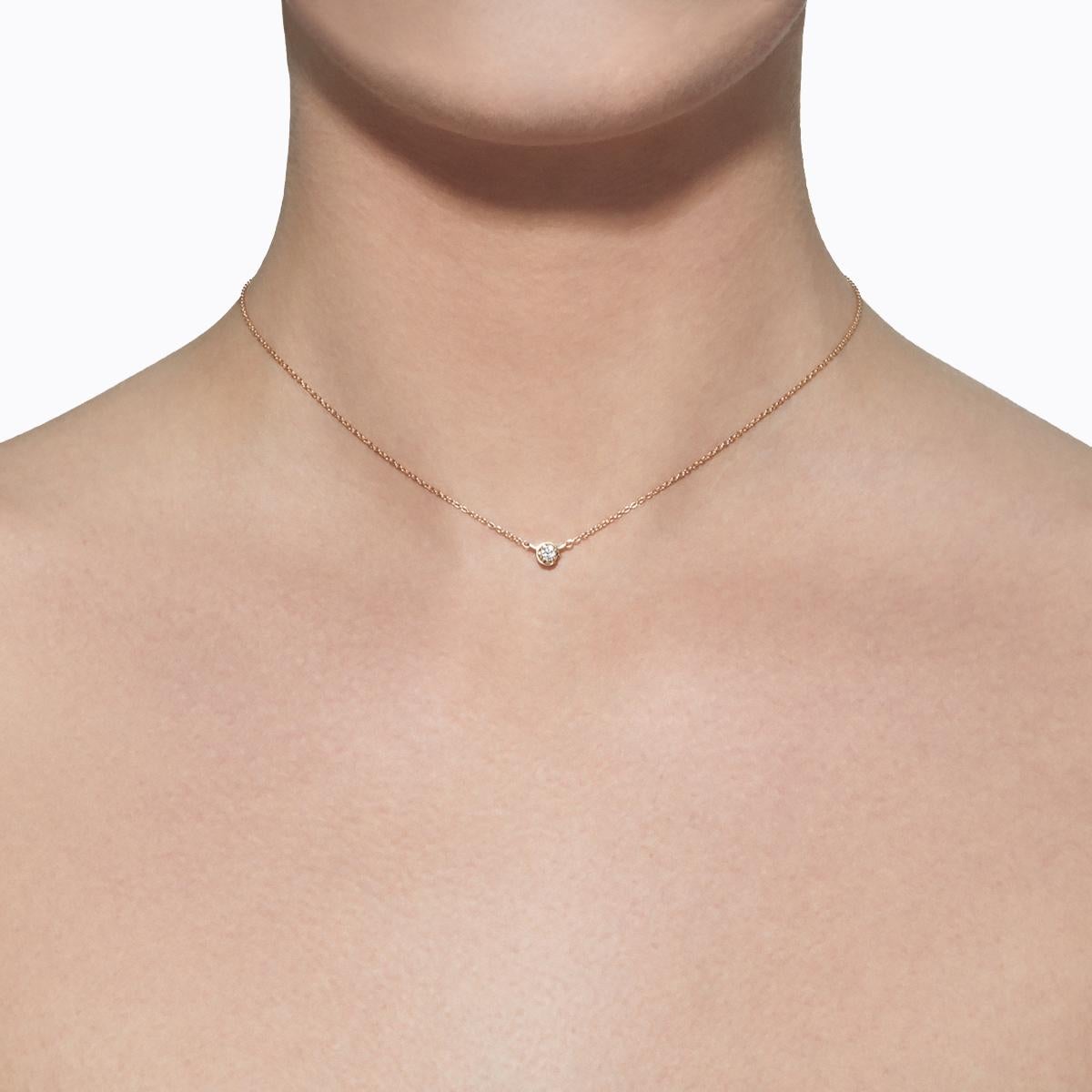 A single stone diamond necklace. Unlike traditional chain and pendant necklaces with a separate clasp, the diamond setting itself doubles as a hidden clasp, ensuring the stone is always featured in the front. Turn it horizontally 45 degrees to open