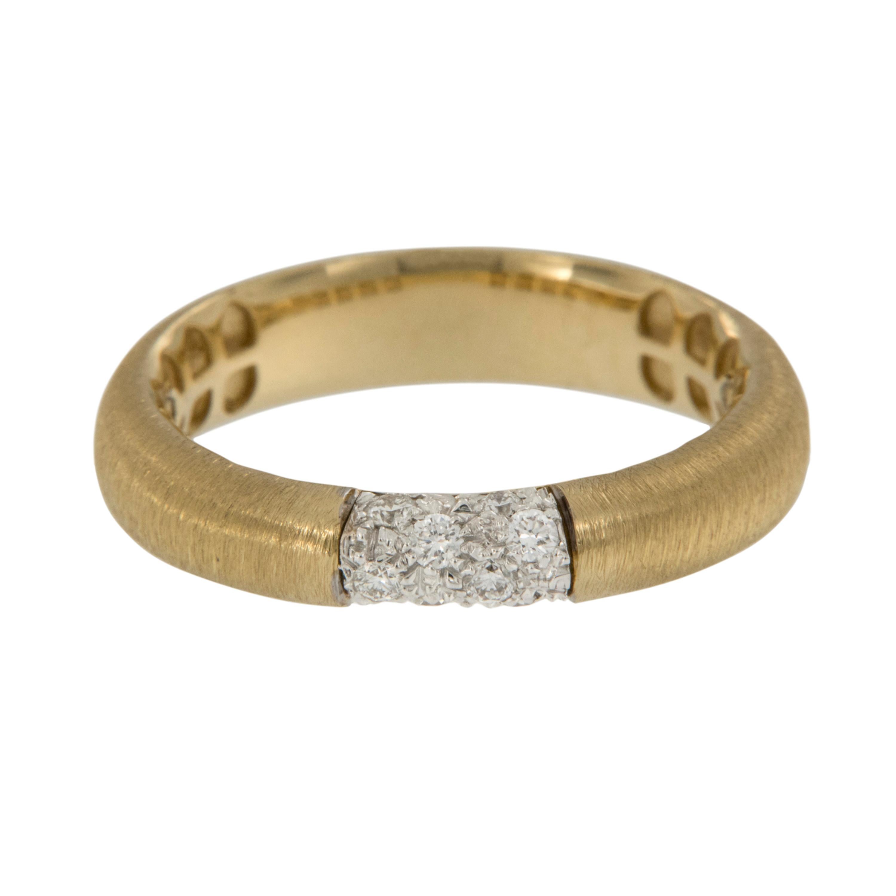 Reminiscent of spun silk & feeling just as luxurious on your finger, this royal 18 karat yellow gold ring is perfectly accented with  0.17 Cttw  of fine, white diamonds pave set in center. Ring is a size 7. Complimentary signature wrapping &