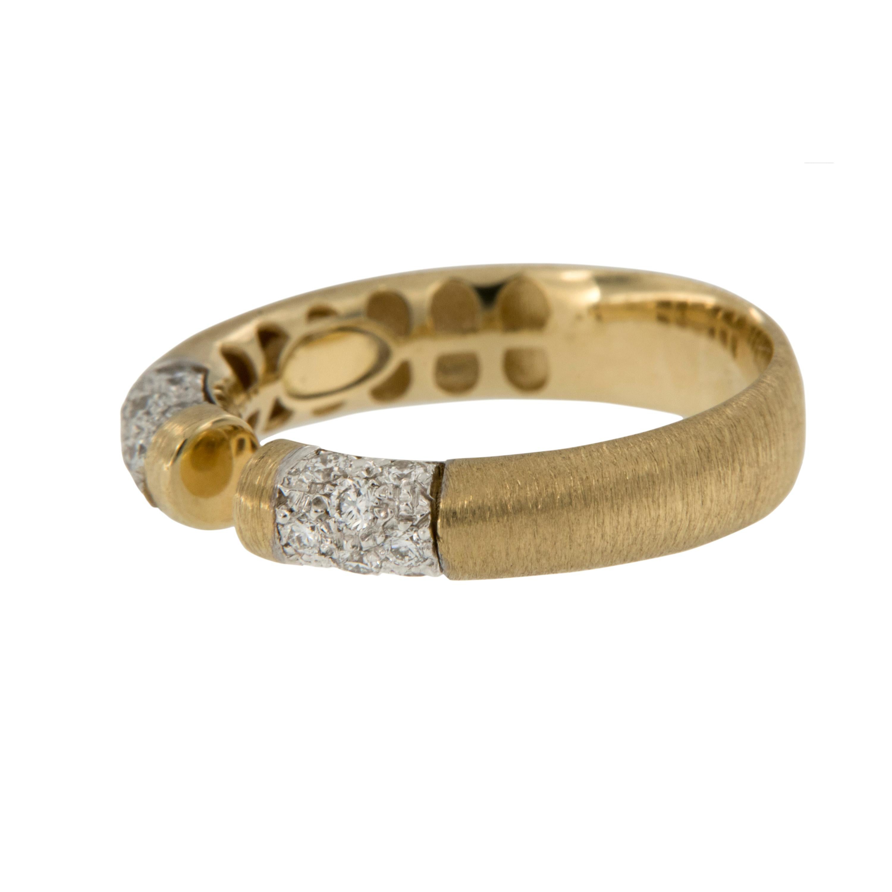 Reminiscent of spun silk & feeling just as luxurious on your finger, this royal 18 karat yellow gold ring is perfectly accented with  0.29 Cttw  of fine, white diamonds pave set on either side of the open center designed ring. Complimentary