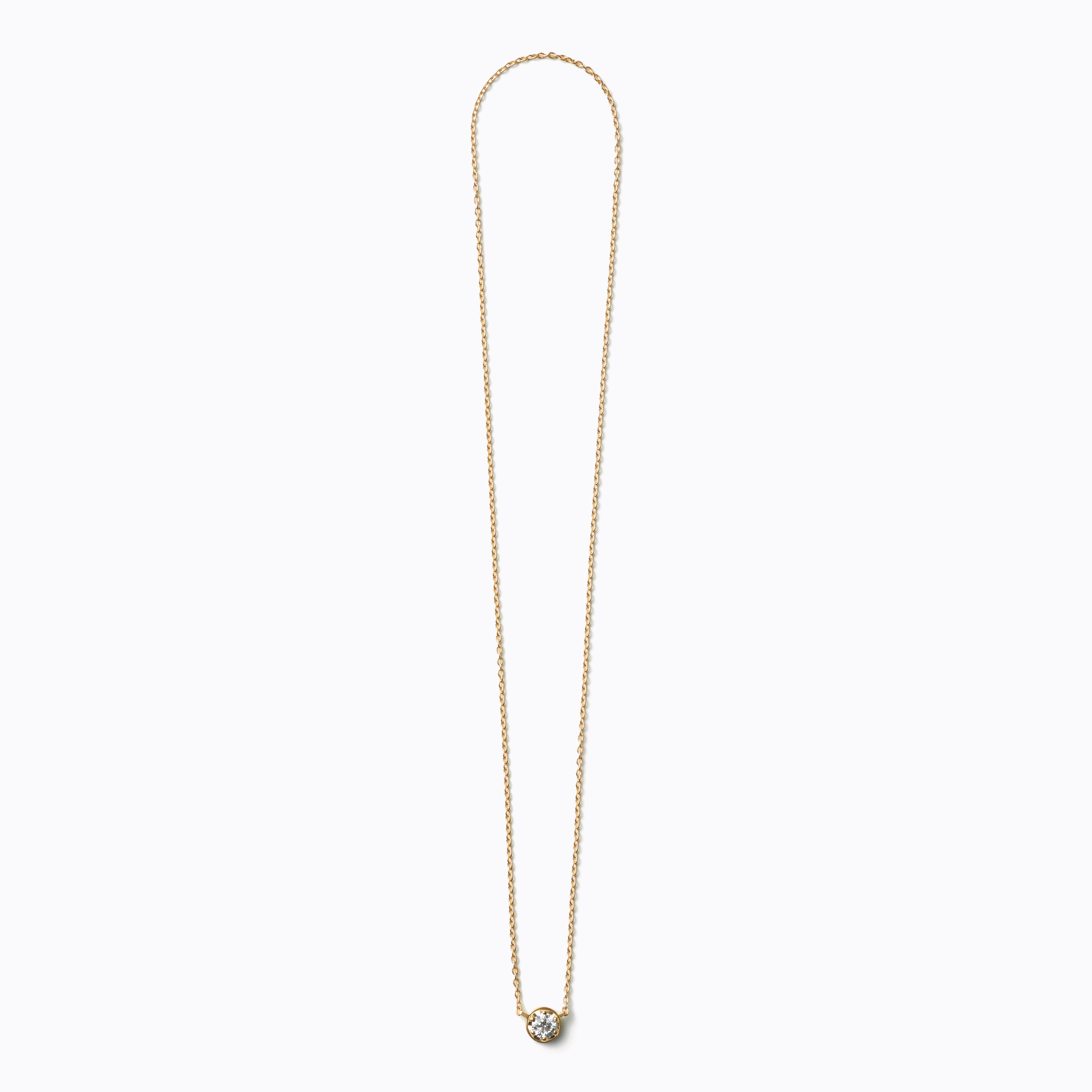 A single stone diamond necklace. Unlike traditional chain and pendant necklaces with a separate clasp, the diamond setting itself doubles as a hidden clasp, ensuring the stone is always featured in the front. Turn it horizontally 45 degrees to open