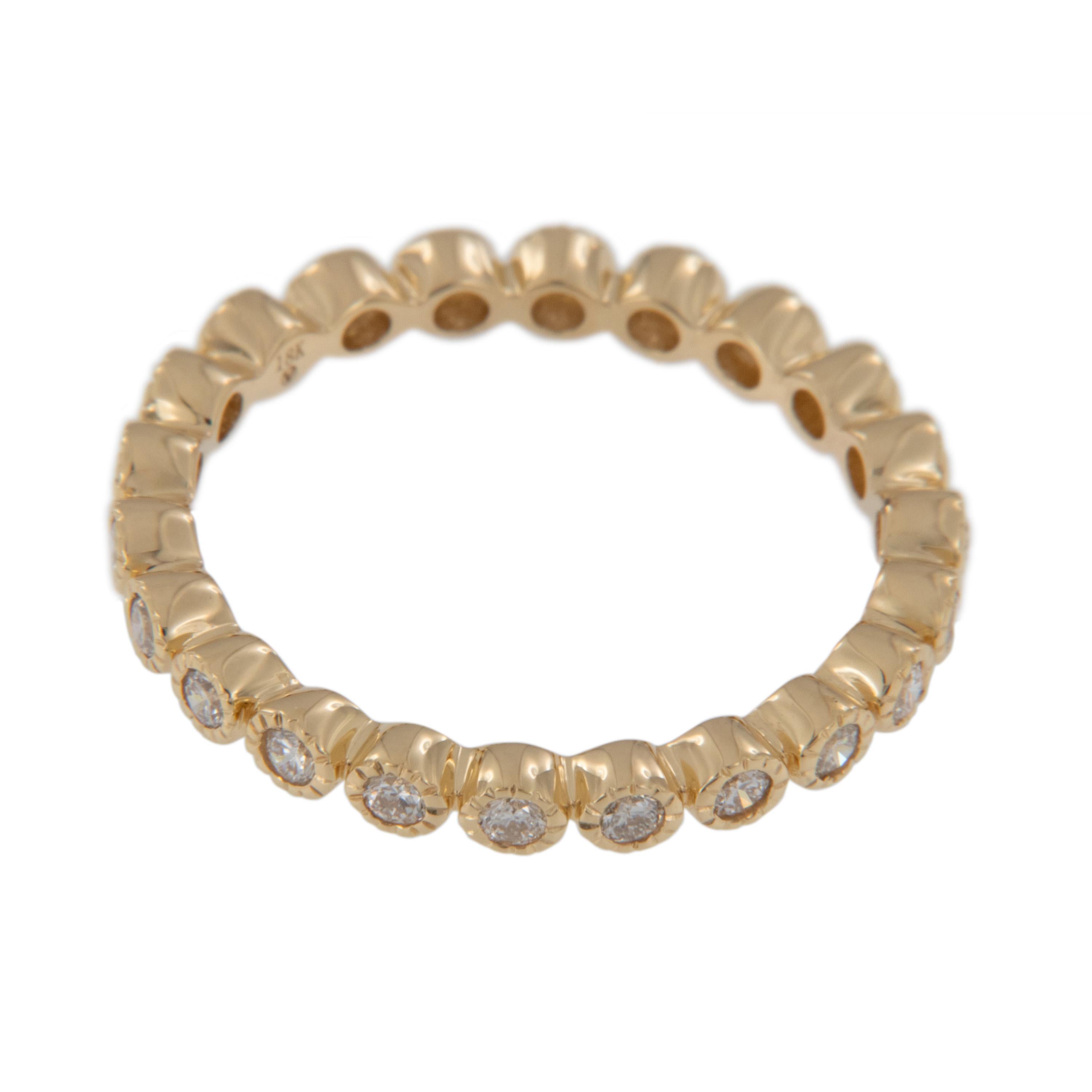 Created from rich 18 karat yellow gold, this beautiful eternity band boasts 23 fine round brilliant cut diamonds = 0.42 Cttw each individually set in milgrain edged bezels for a stunning look on its own or check out our white and rose gold matching