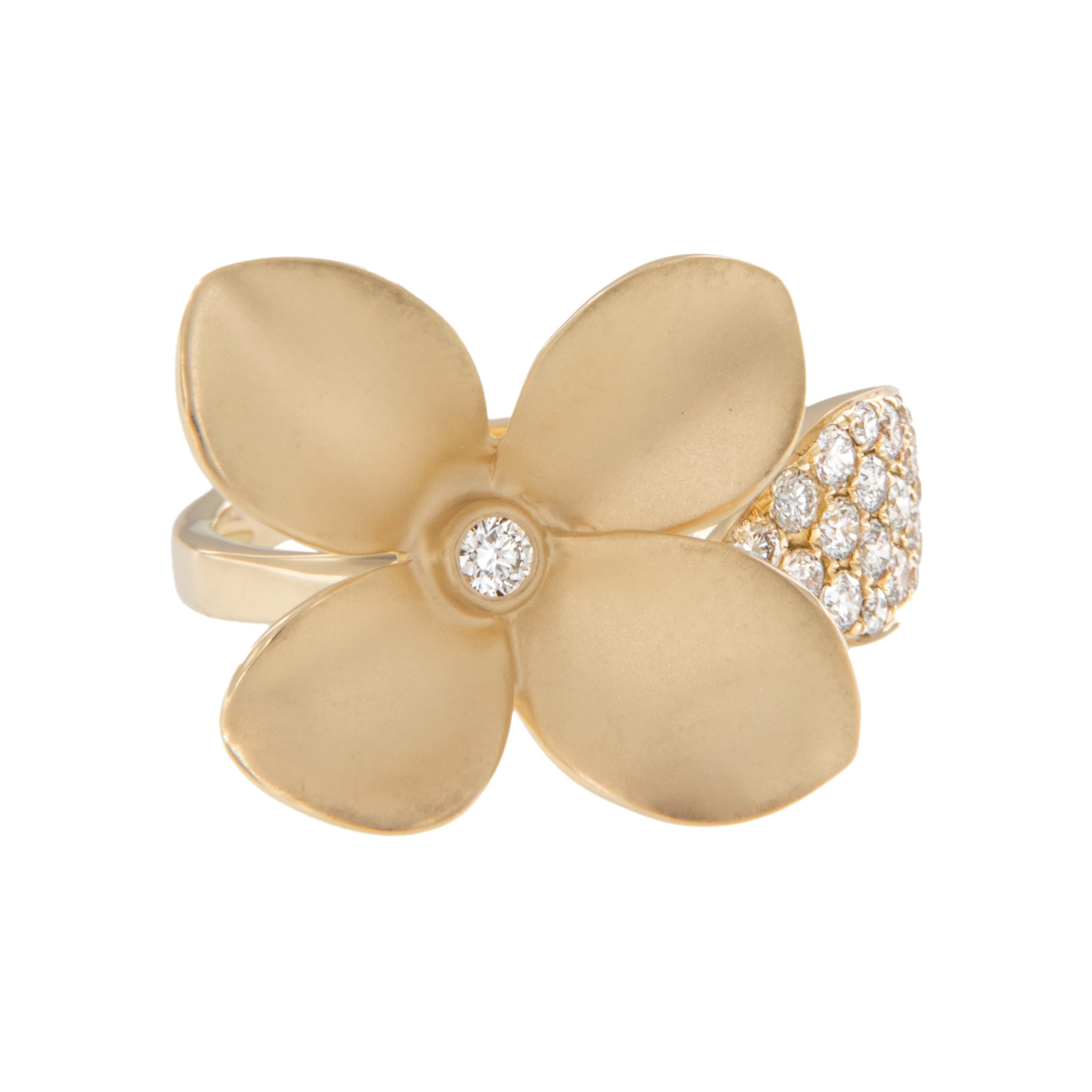 This special floral ring is crafted in rich 18 karat yellow gold. Dogwood flowers are most often used as symbols of rebirth. They are also connected to durability and the ability to withstand various challenges in life and are thus used by many