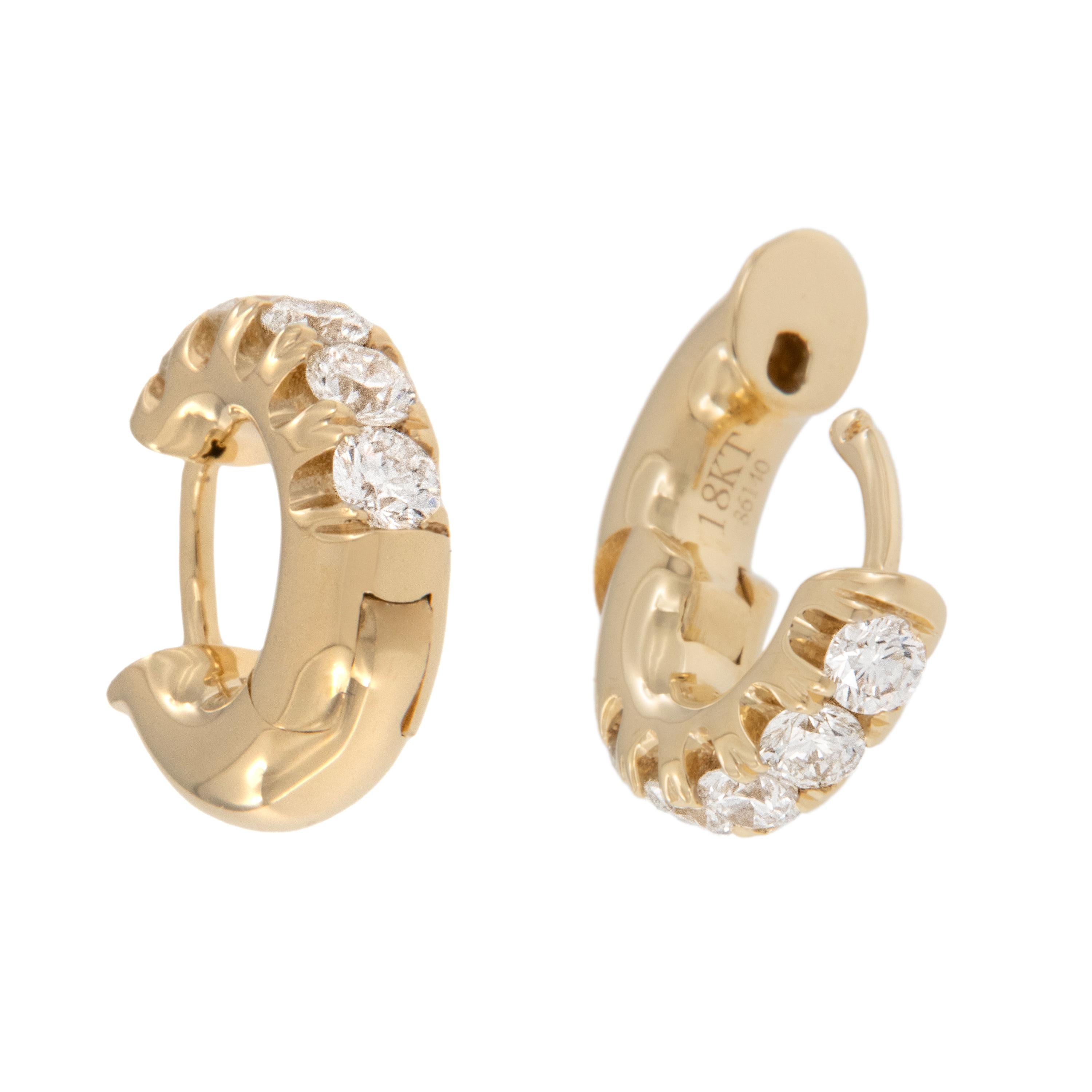 Beautiful split prong diamond earrings you can wear every day! Made from fine 18 karat yellow gold, these huggy earrings boast 0.50 Cttw. of VS clarity, G-H color diamonds. Being huggy style the hinged earring backs come up to click into the front