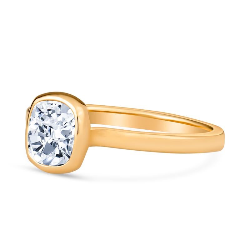 This very unique engagement ring features a bezel set 0.56 carat rose cut natural diamond set in 18 karat yellow gold. It can also be worn on any finger for a statement ring. It is a size 6 but can be resized upon request.
