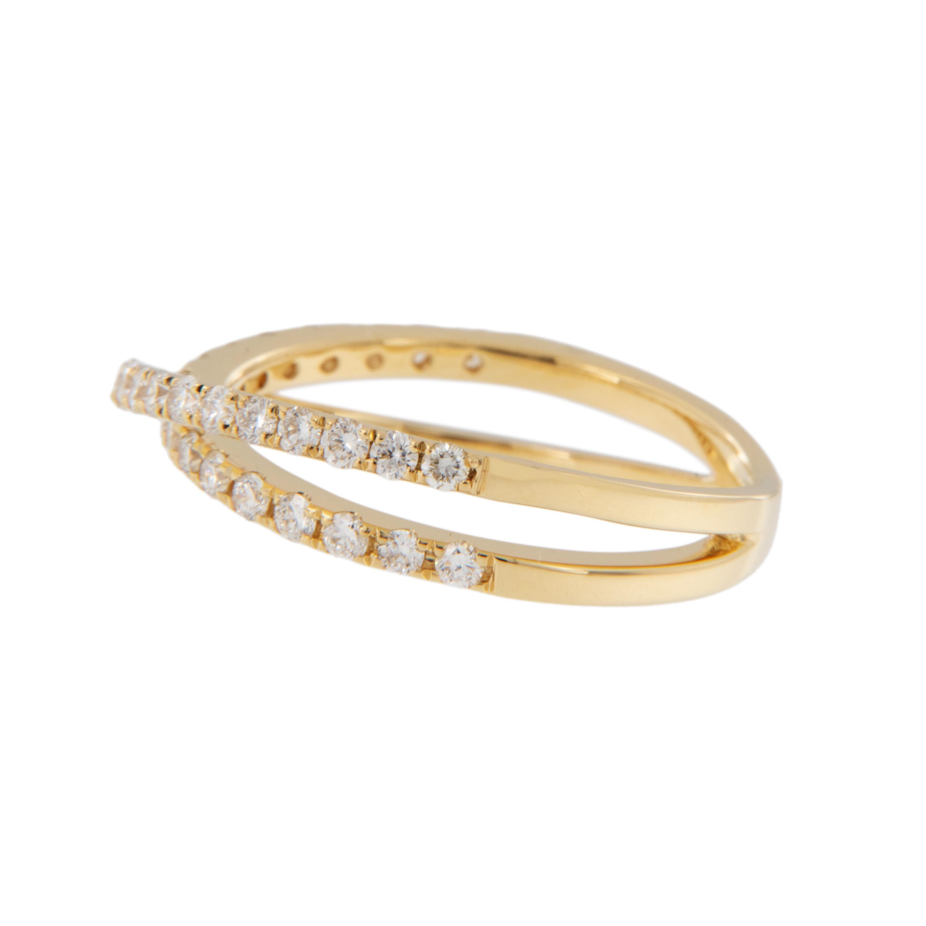 Ladies - it's time to raise your right hands! This perfect right hand crossover ring is made of 18 karat yellow gold in the iconic 