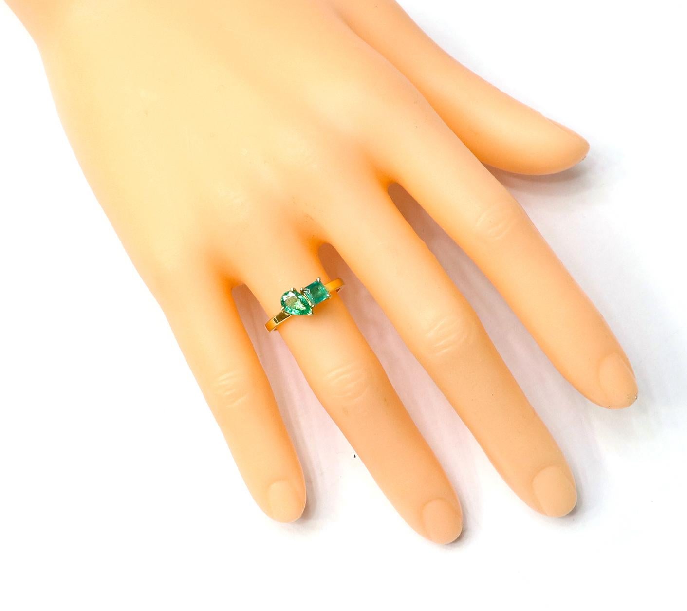 18 Karat Yellow Gold 0.98 Carats Natural Emerald Two-Stone Modern Fashion Ring

Meet your new everyday essential ring. Carefully Handcrafted, this contemporary design features a Pear Natural Emerald in a four-prong setting along with a Square-Cut