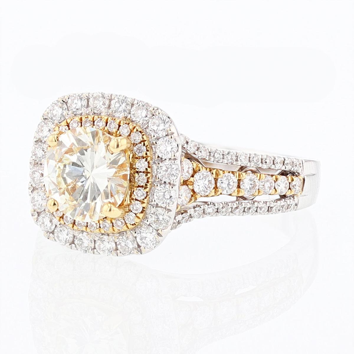 This diamond engagement ring is made with 18 karat white and yellow gold and features 1 certified prong set round diamond weighing 1.02cts (EGL US Certification number: 66456609D) with a color grade (Q-R) and a clarity grade (VS2) and 104 prong and