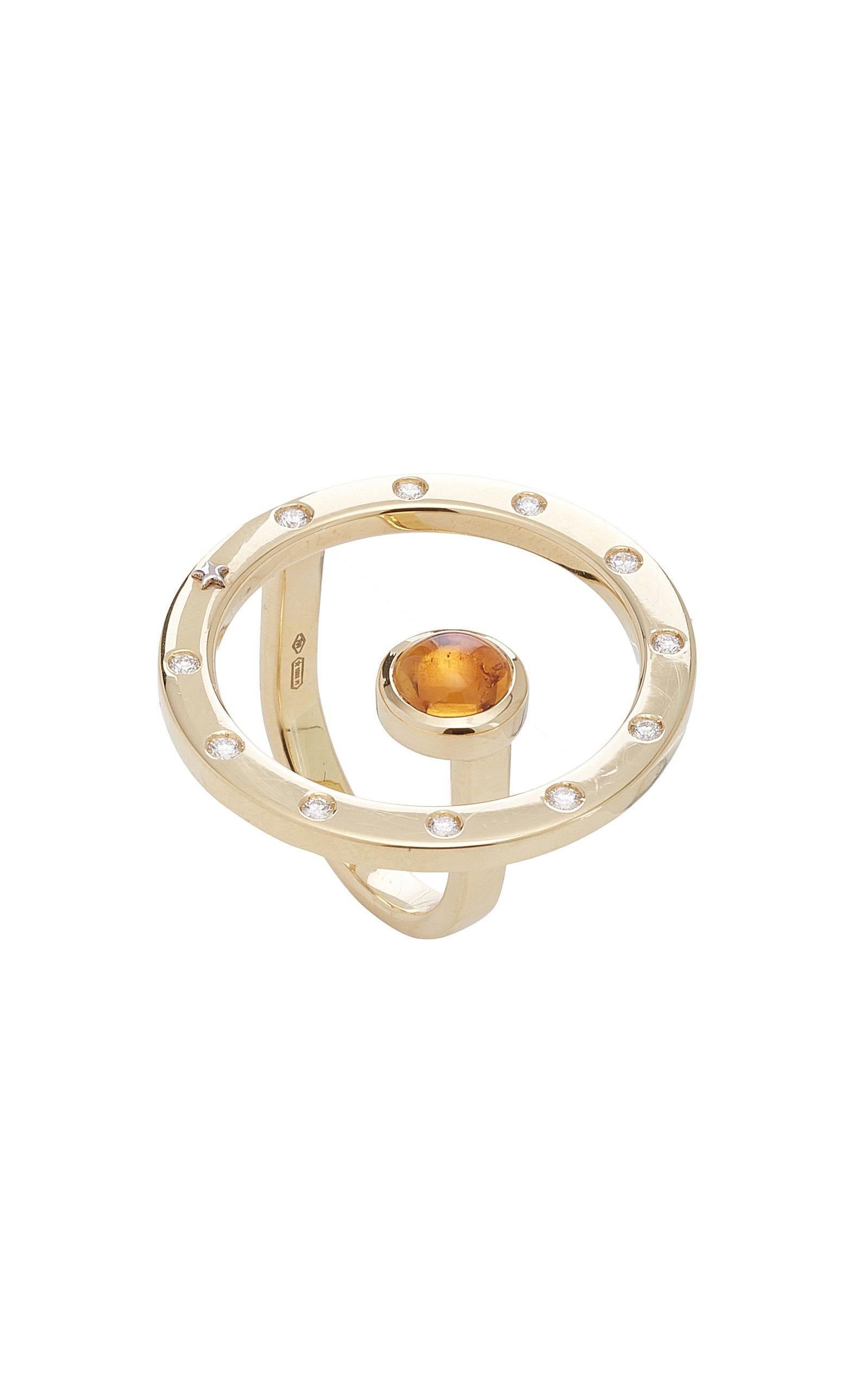 Inspired by the concept of time, Anna Maccieri Rossi's 'ORA Ring' features a circular silhouette with natural citrine quartz cabochon at center. The hours of the day are marked by the 11 white diamonds and star at 8 o'clock around the rim.
PRODUCT