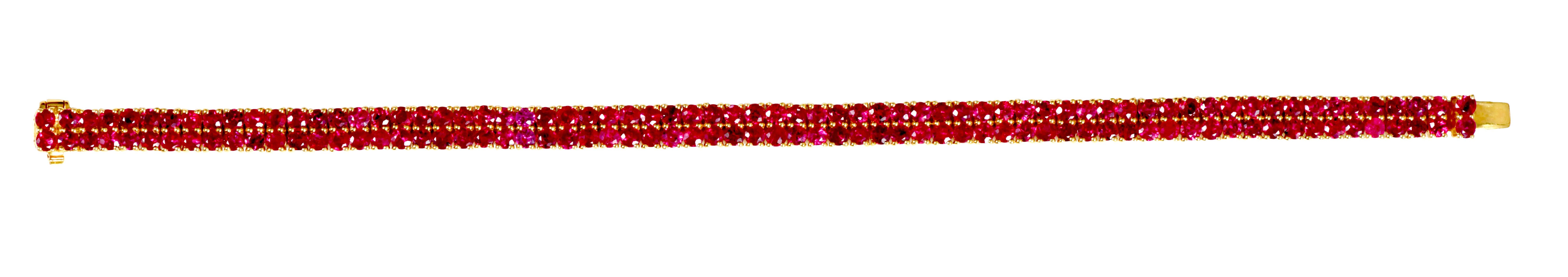 18 Karat Yellow Gold 11.13 Carat Ruby Double-Row Contemporary Style Tennis Bracelet

The sparkle of beautiful rubies, the essence of its rarity, all wrapped around your wrist. This bracelet is a sparkling treat to the eyes and the heart. Each