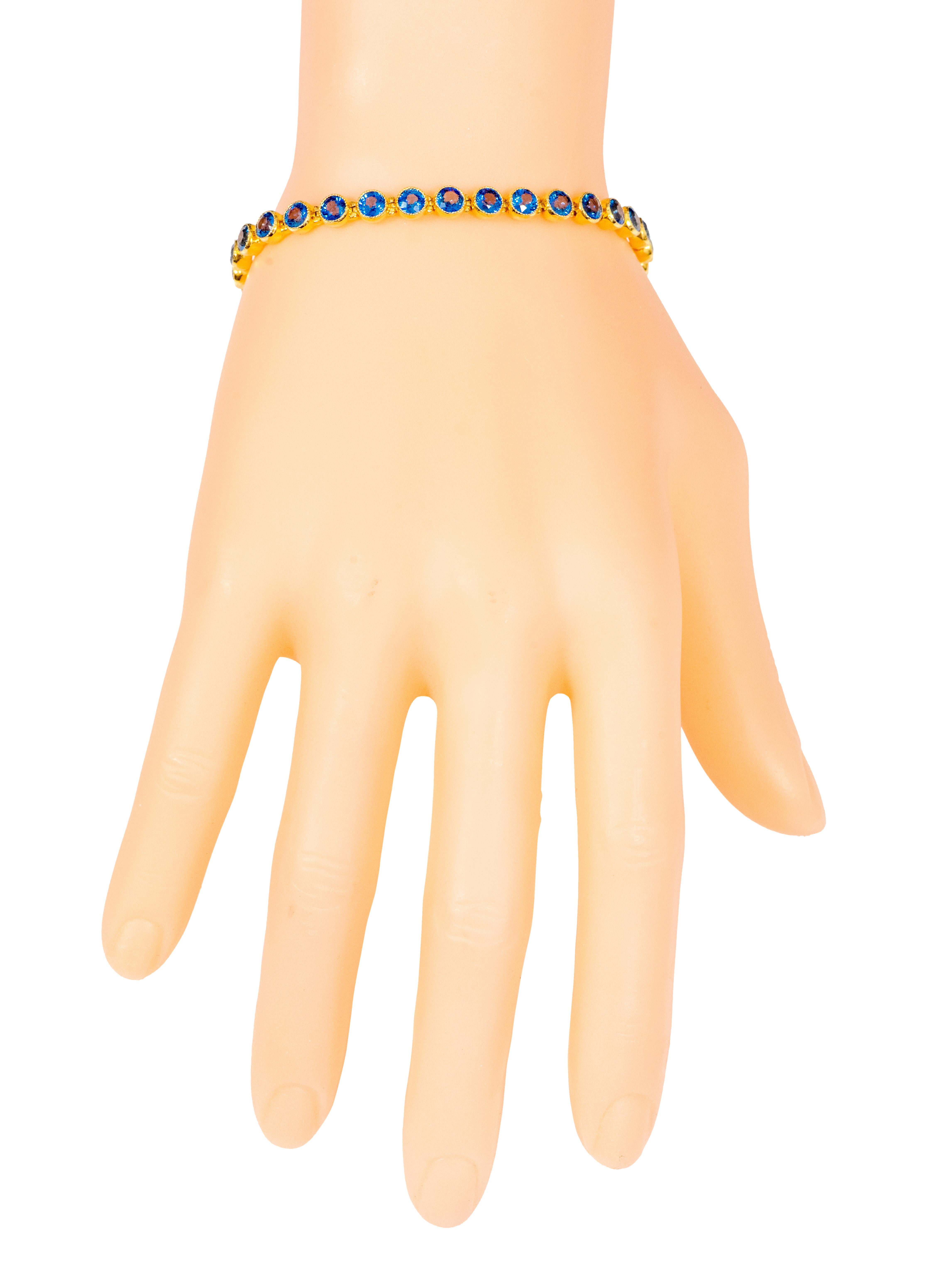 Modern 18 Karat Yellow Gold 11.72 Carat Blue Sapphire Tennis Bracelet in Bezel Setting