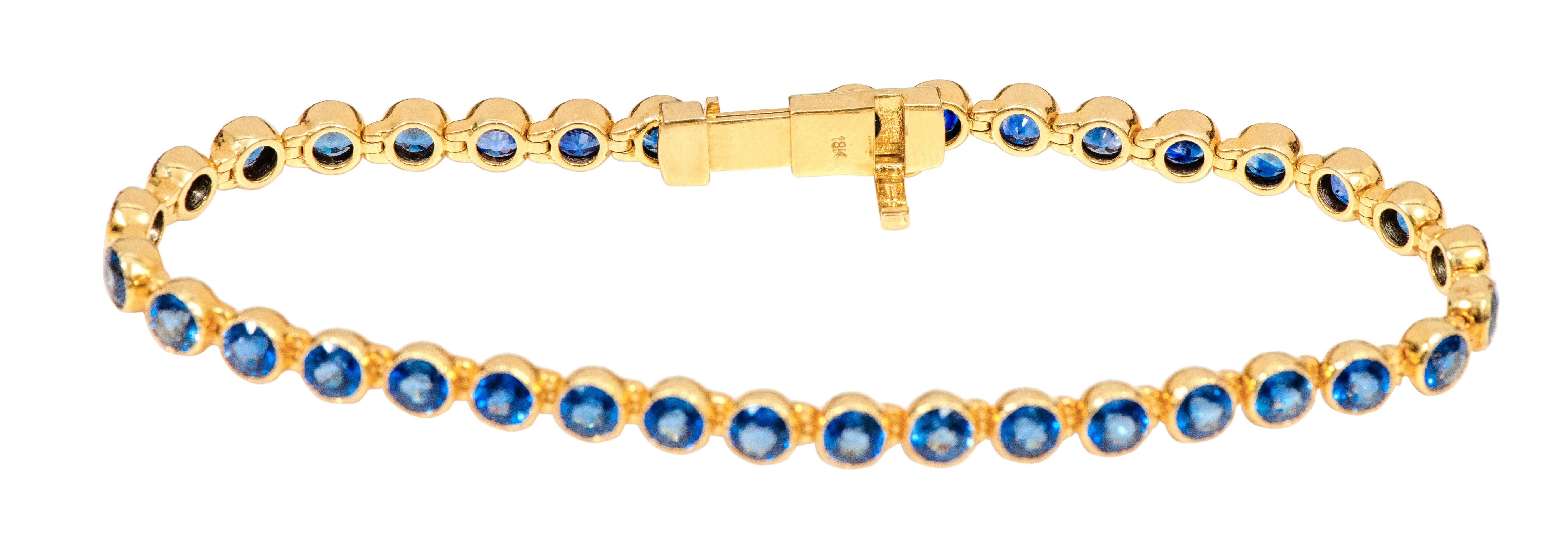 Women's 18 Karat Yellow Gold 11.72 Carat Blue Sapphire Tennis Bracelet in Bezel Setting