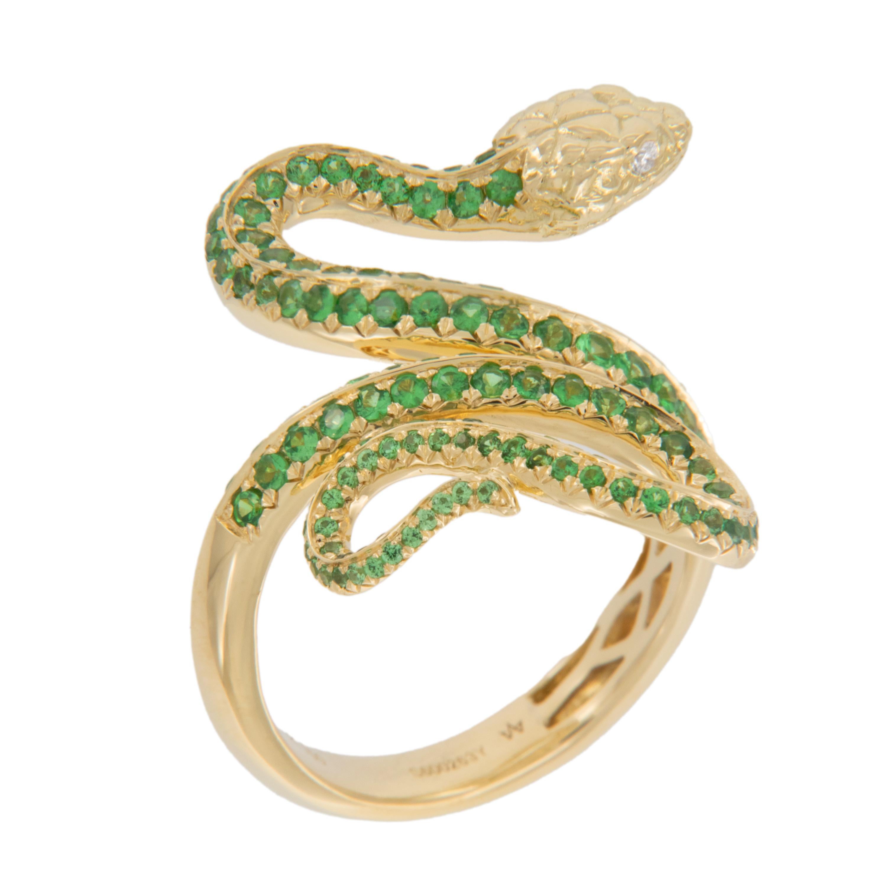 Graceful and elegant, serpents have symbolized guardianship, fertility and rebirth for centuries. This beautiful ring is comprised of rich 18 karat yellow gold with 146 tsavorites = 1.32 Cttw (VS) as the 