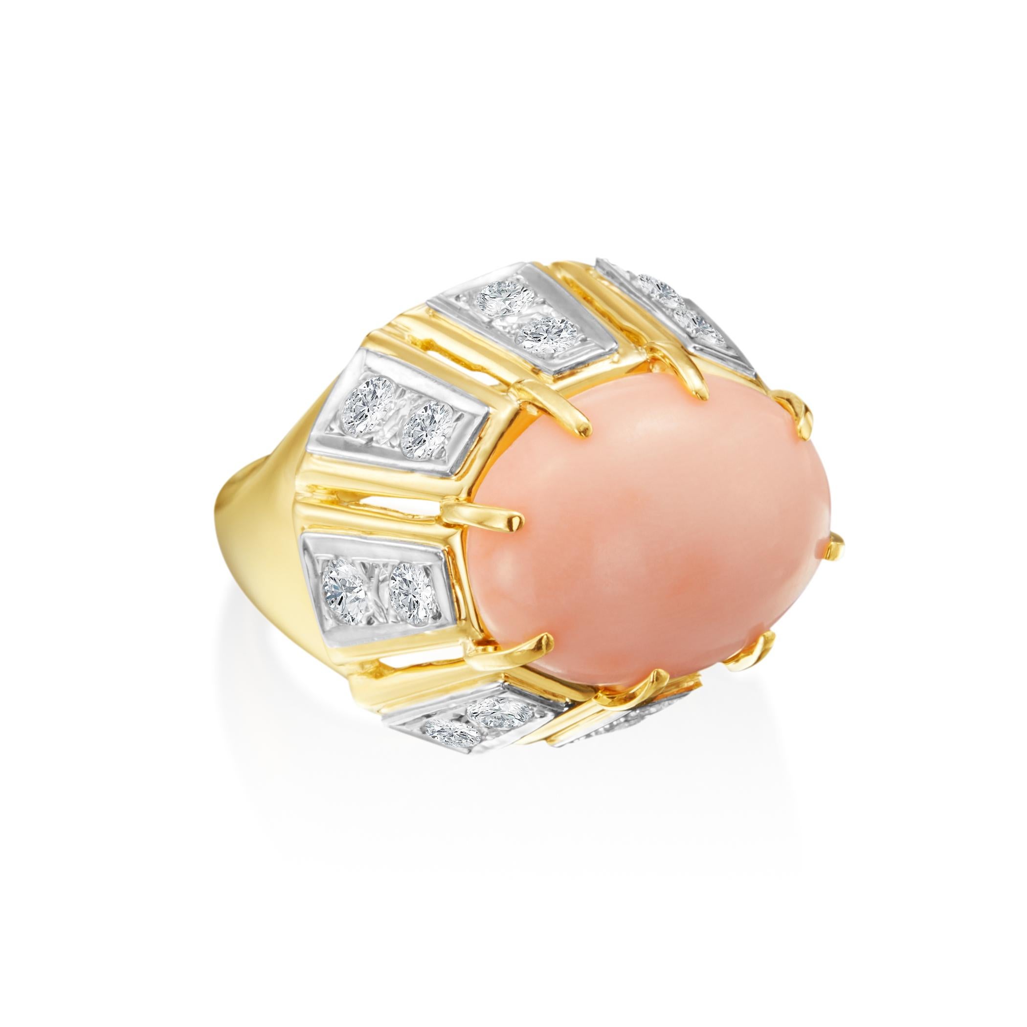 A unique 14.57ctw oval angel skin Coral is prong set as the centerpiece of this incredible 18K yellow gold ring. With 16 round brilliant cut diamonds (G-H color; VS internal clarity)that are vertically set around the Coral Dome gemstone. This