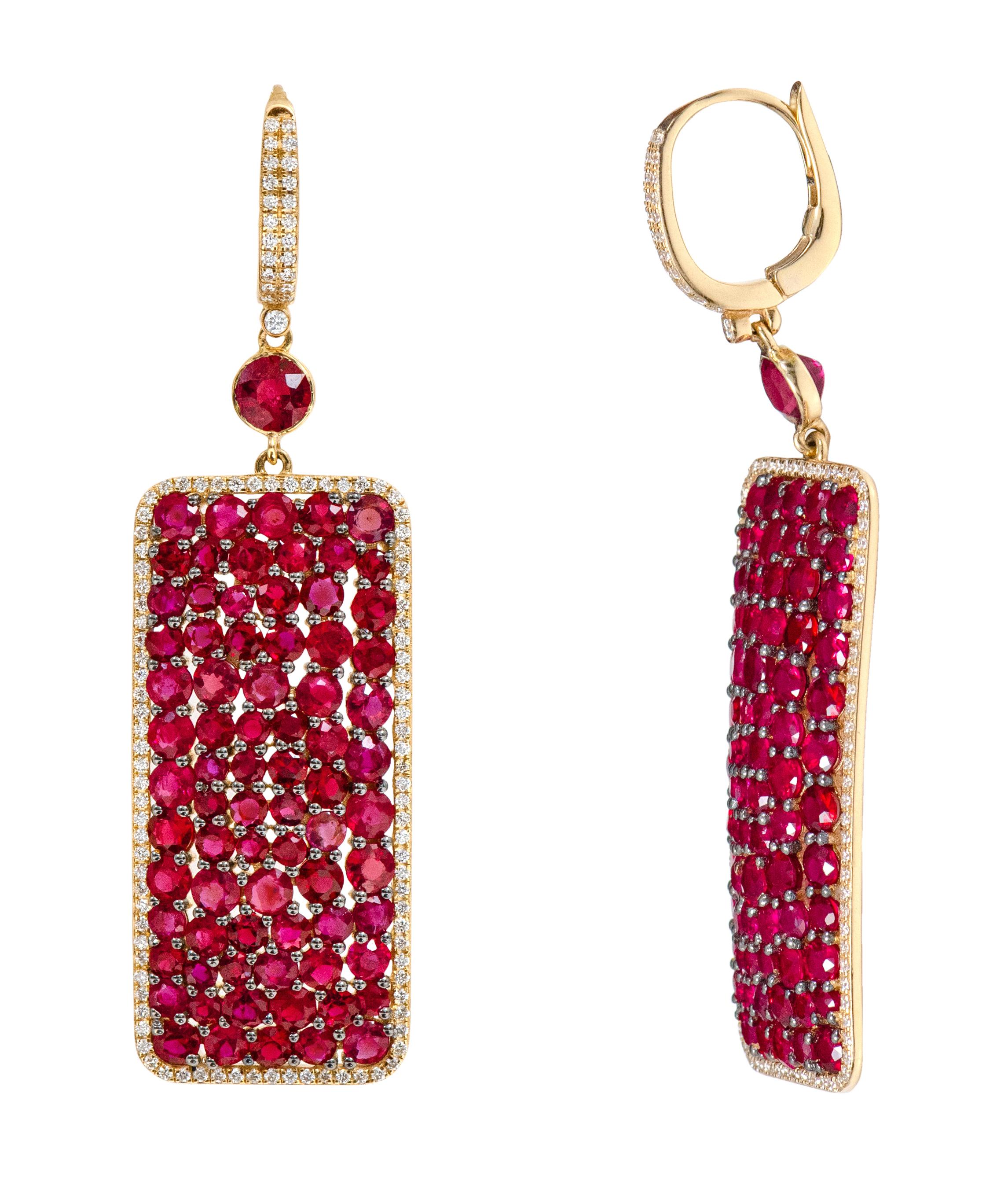 18 Karat Yellow Gold 16.35 Carat Ruby and Diamond Drop Earrings

This sensational pigeon blood ruby and diamond long earring is articulate. The beautiful composition of pave set mixed size round solitaire rubies form the rectangle shape of the