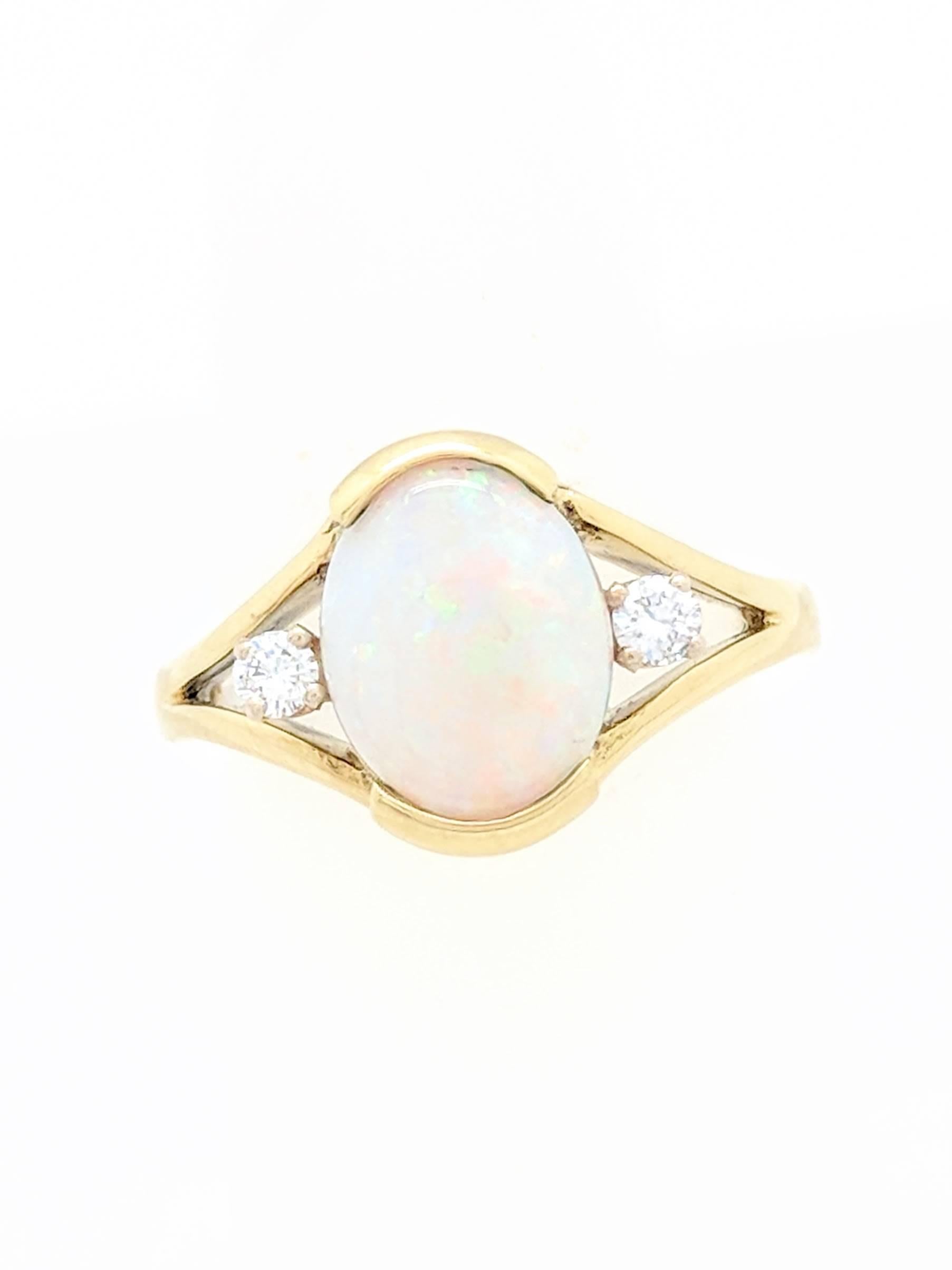 Oval Cut 18 Karat Yellow Gold 1.65 Carat Natural Opal and Diamond Ring