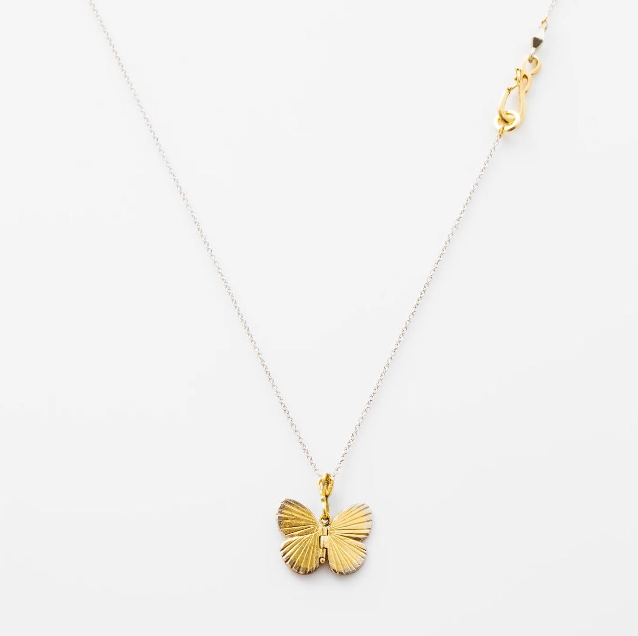 James Banks's signature butterfly necklace features a Baby Asterope butterfly with a hinge at the center to allow movement of the wings, set in 18k Yellow Gold with 18k White Gold inlay trim and hung on a 17