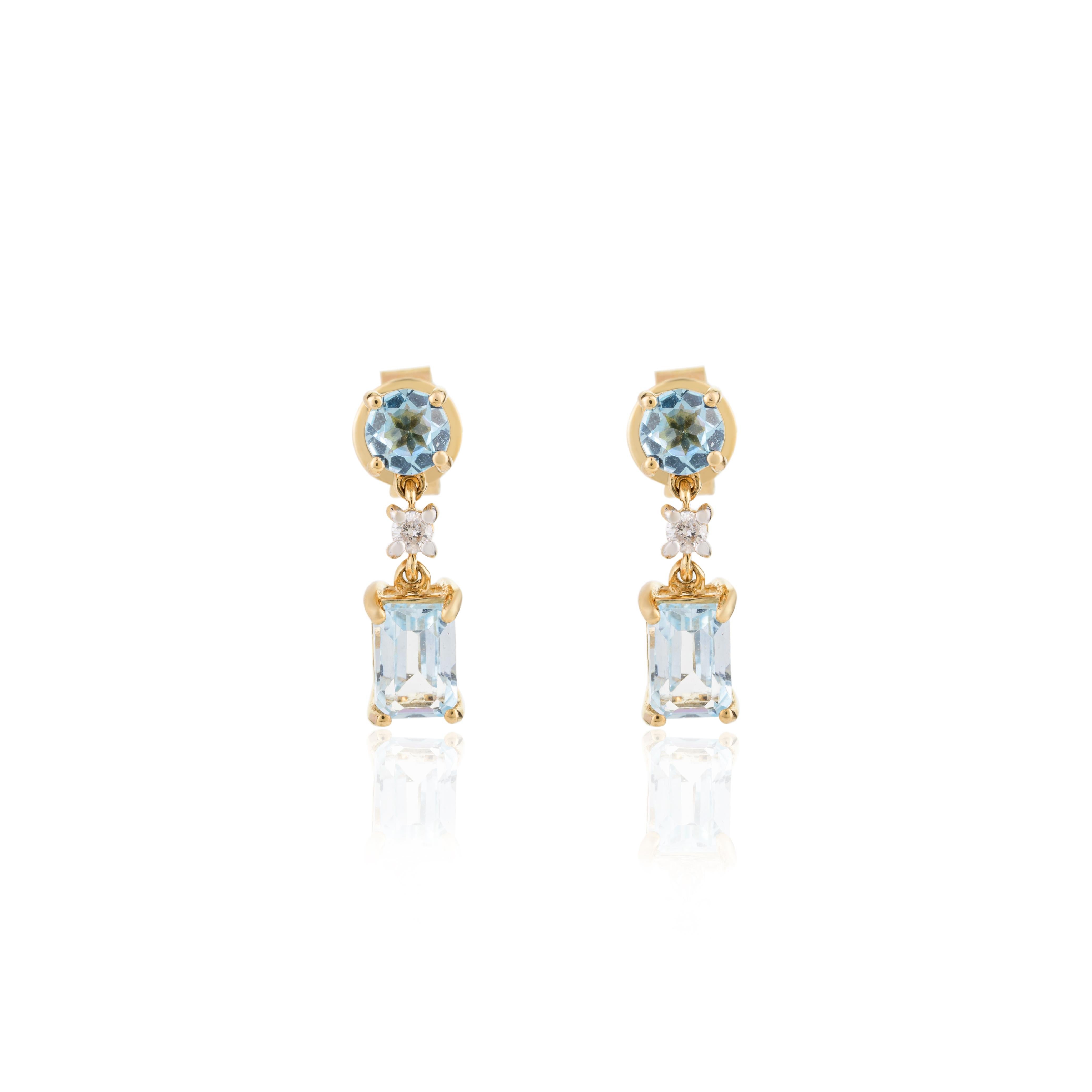 2 Carat Blue Topaz Drop Earrings in 18K Gold to make a statement with your look. You shall need dangle earrings to make a statement with your look. These earrings create a sparkling, luxurious look featuring baguette and round cut topaz and round
