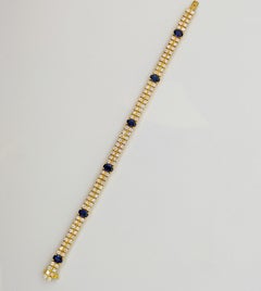 18 Karat Yellow Gold, 2-Row Diamond Bracelet with 3.19 Carat Oval Blue Sapphires