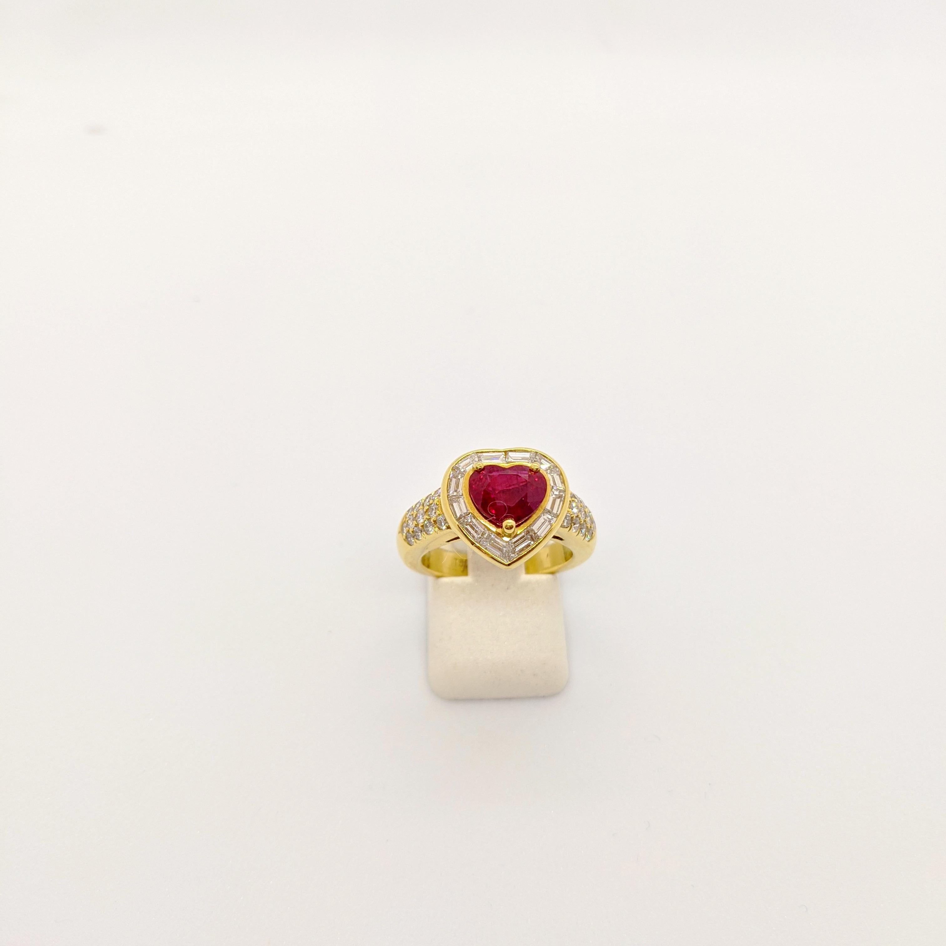 Cellini Jewelers NYC crafted this beautiful one of a kind ring which centers a 2.09 all natural Ruby heart, which is surrounded by .78 carats of baguette cut diamonds. The top of the shank is adorned with .39 Carats of round diamonds. 
Ring size