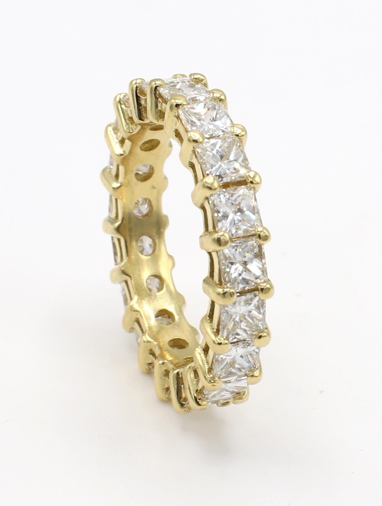 18 Karat Yellow Gold 2.30 Carat Princess Cut Diamond Eternity Band Ring Size 4.75
Metal: 18k yellow gold
Weight: 3.72 grams
Diamonds: 19 princess cut diamonds, approx. 2.30 CTW G-H VS 
Size: 4.75 (US)
Width: 4MM
