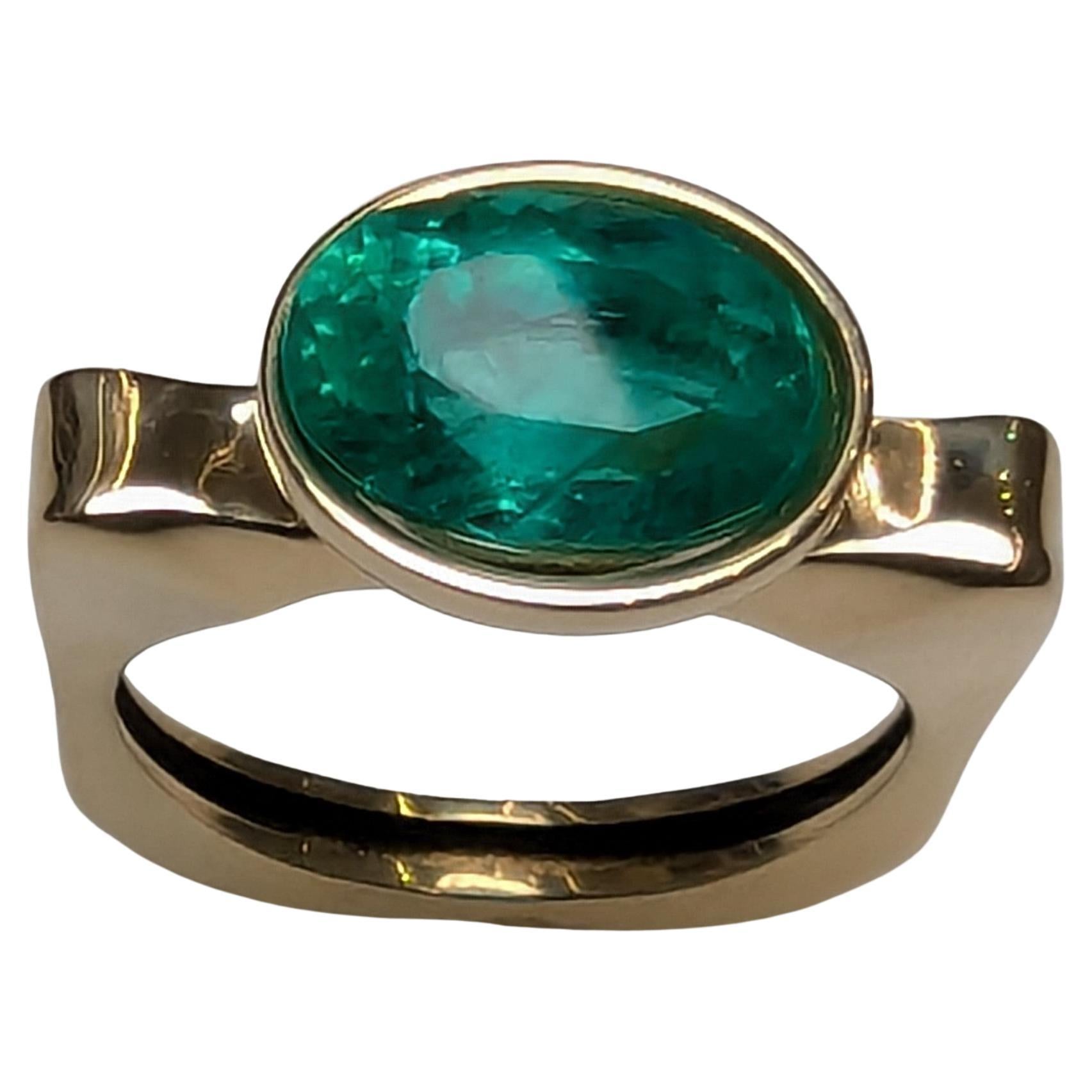 For Sale:  18 Karat Yellow Gold 2.86 Carat Oval Emerald Sculpture Ring