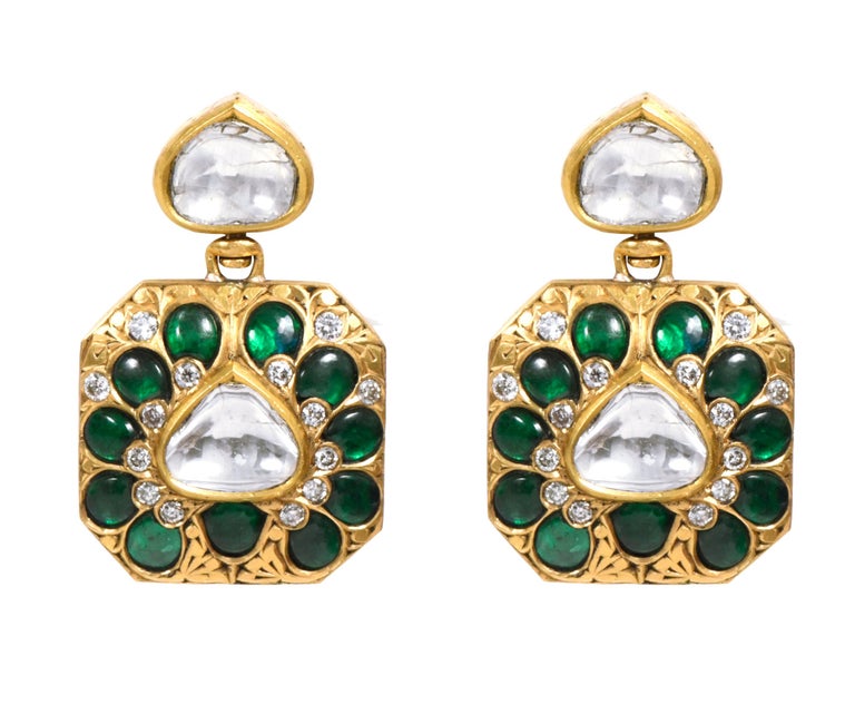 18 Karat Yellow Gold 29.90 Carat Diamond, Emerald, and Sapphire Handcrafted Dangle Earrings

This unique two-way vivid green emerald, royal blue sapphire and diamond earring is impeccable. The bottom hexagon shape is brilliantly formed in a flower