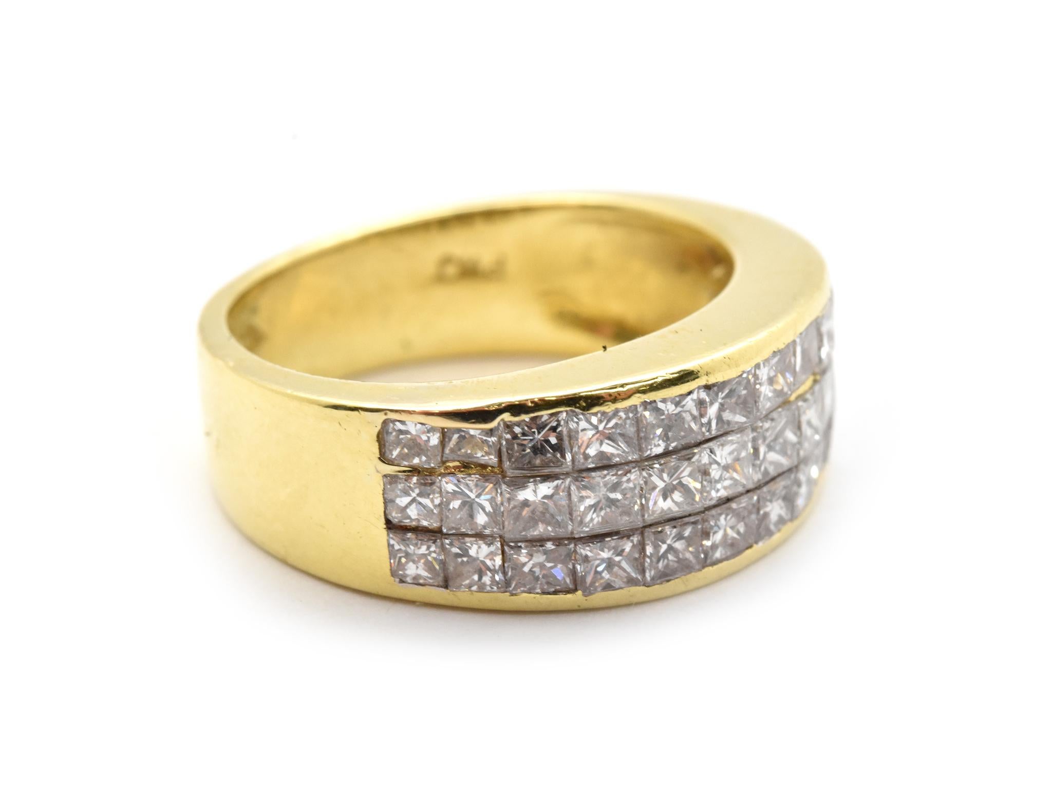 This fabulous band features invisible-set princess-cut diamonds in 18k yellow gold. The diamonds have a total weight of 2.00ct, and they are graded H-I in color and SI-I in clarity. The band measures 8mm wide, and it weighs 7.40 grams. The ring is