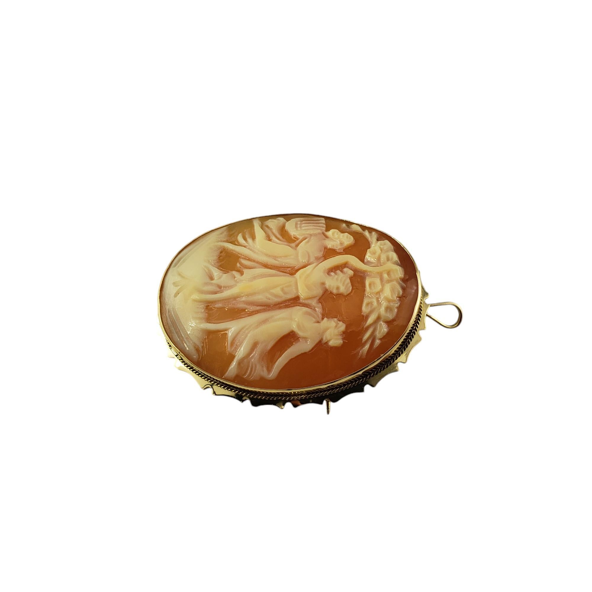 18 Karat Yellow Gold 3 Women Cameo Brooch/Pendant-

This elegant cameo features three dancing ladies set in 18K yellow gold.  Can be worn as a brooch or a pendant.

Stamped: ITALY  K18

Size: 35 mm X 30 mm

Weight:  3.1 dwt. / 4.9 gr.

Very good