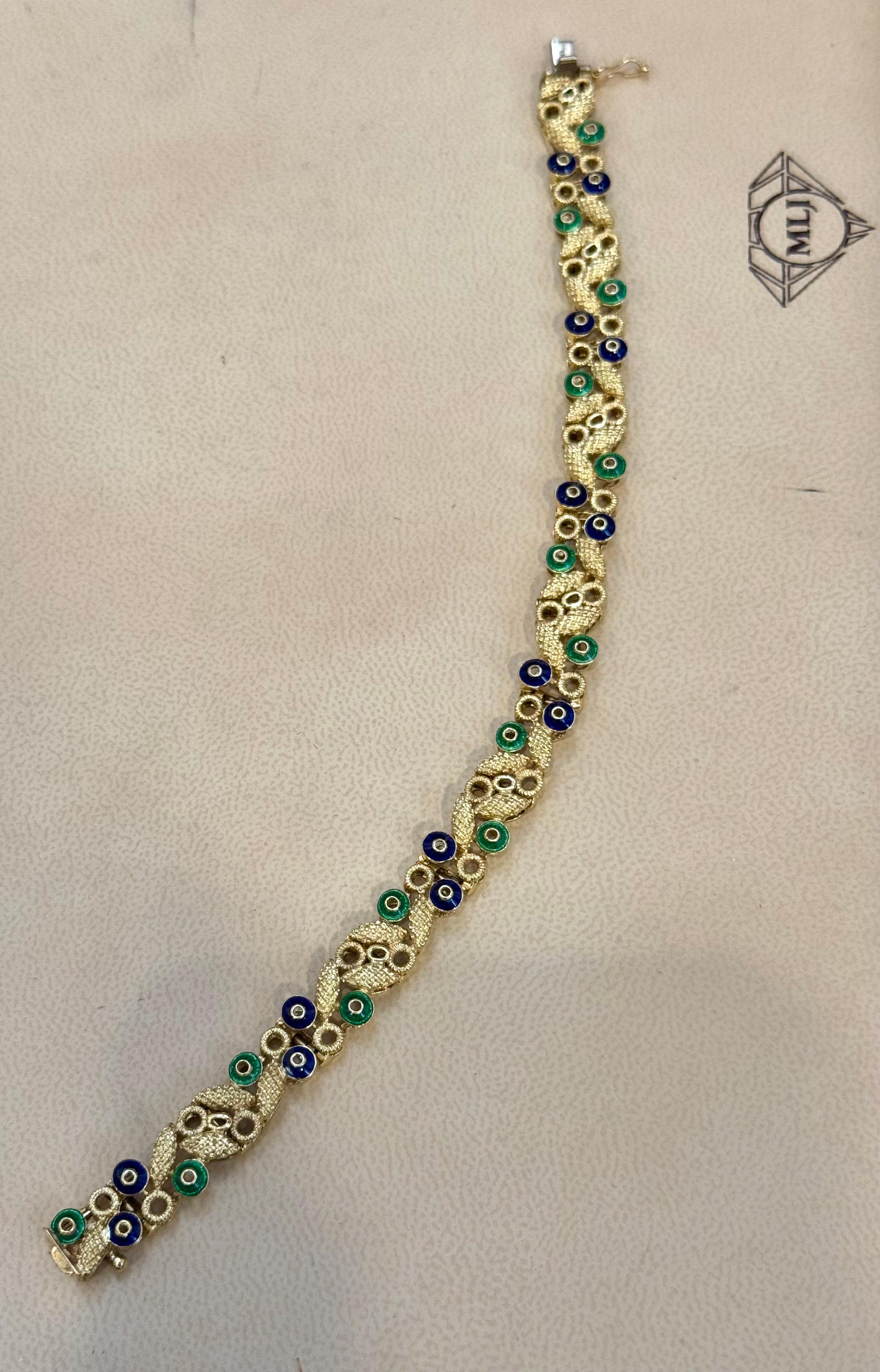 Or jaune 18 carats 30 grammes avec émail vert et bleu  Bracelet, 8 pouces de long
Or 18 carats 30 grammes 
La largeur du bracelet est de 10 mm
Magnifique motif de feuilles avec petit cercle d'émail bleu et vert
La longueur est de 8 pouces 

Suivez