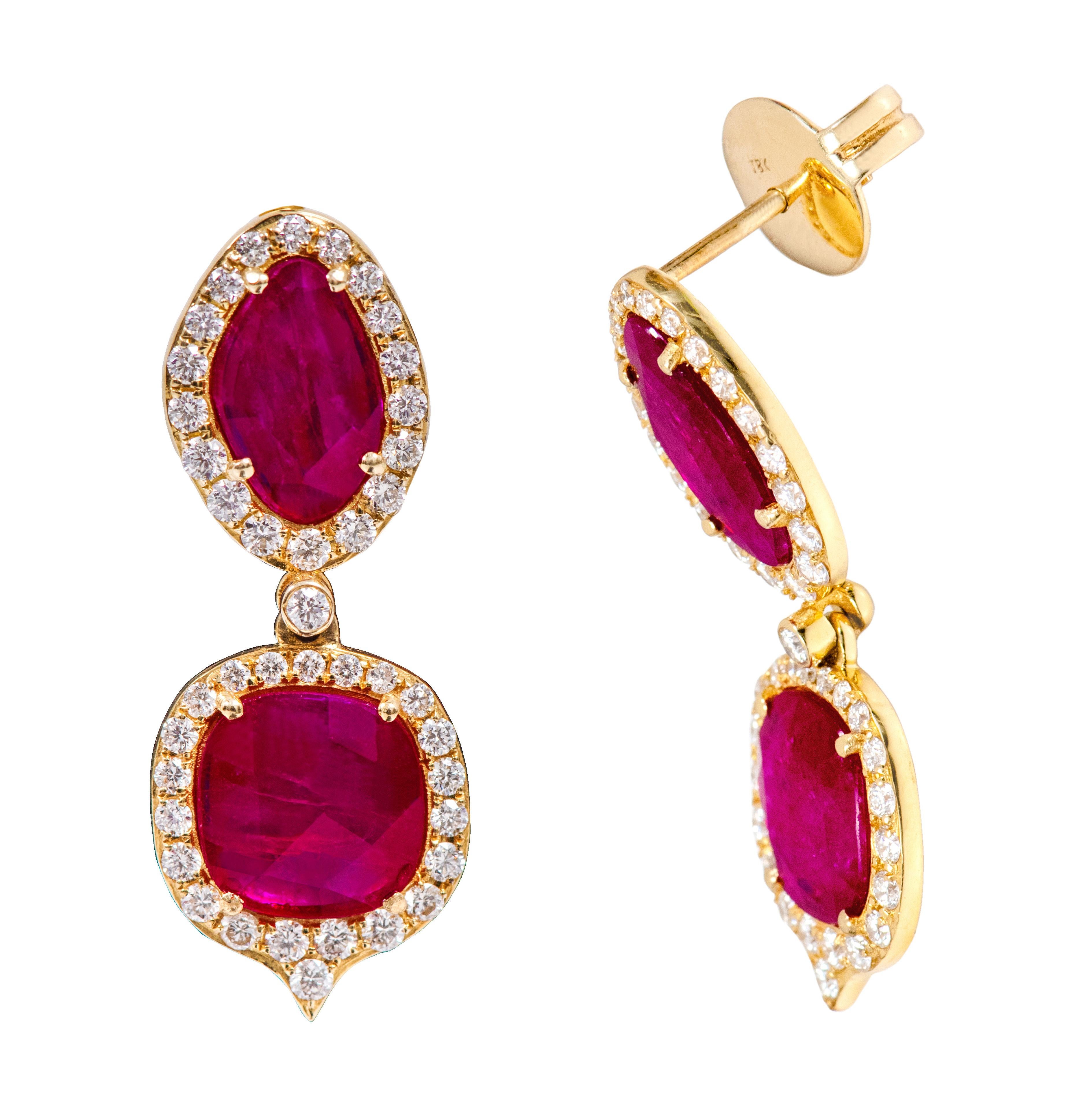 18 Karat Yellow Gold 3.12 Carat Ruby and Diamond Drop Earrings

This unusually cool and magical wine-red oddly sliced cut ruby earring is riveting. It’s made with the uniquely faceted uneven slice red ruby cut with the marquise-oval shape on the