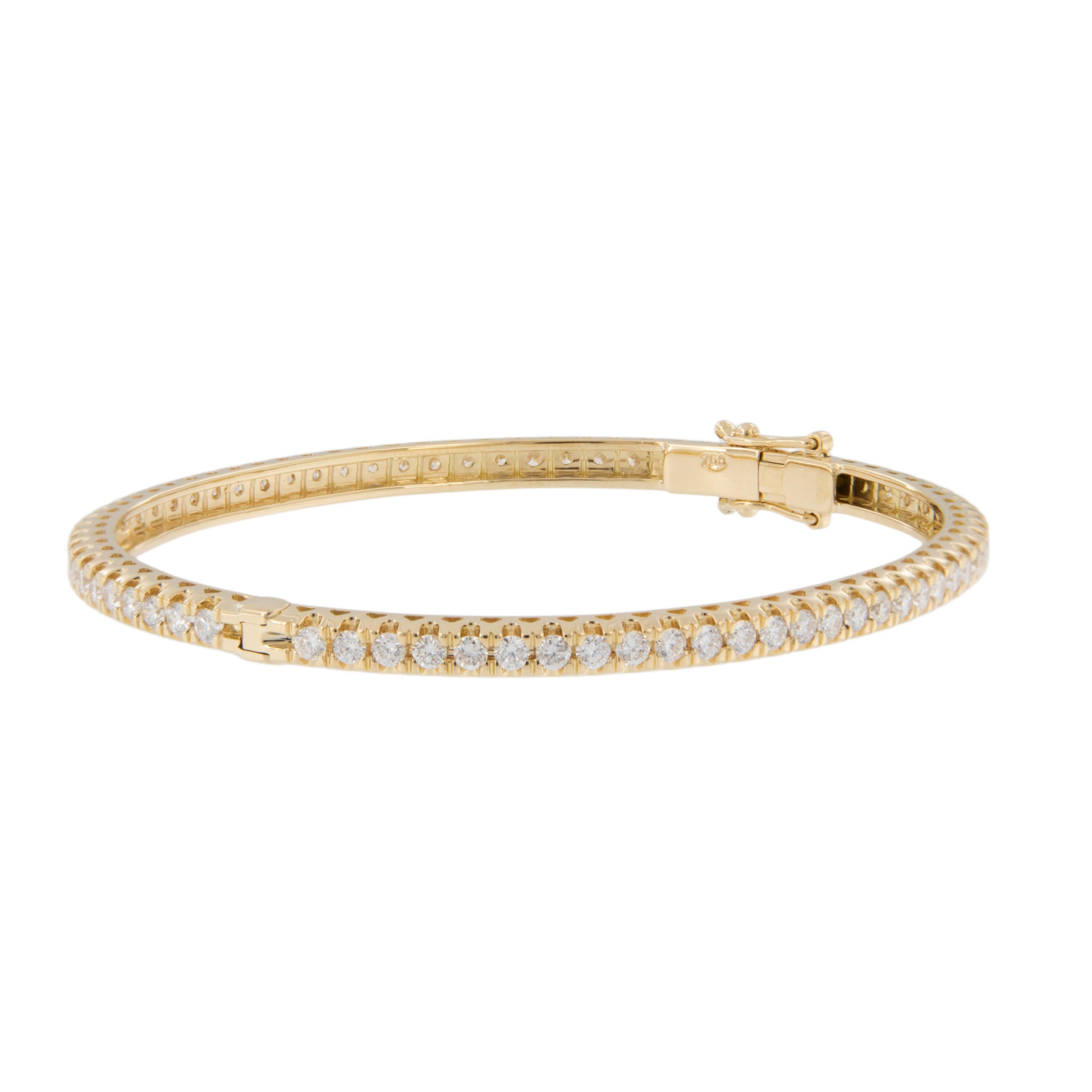 It doesn't get more classic than this 18 karat yellow gold natural diamond eternity bangle bracelet with 3.15 Cttw VS - SI diamonds. Bracelet feel just at home on your wrist while wearing jeans or that perfect black dress!  Worn on its own or
