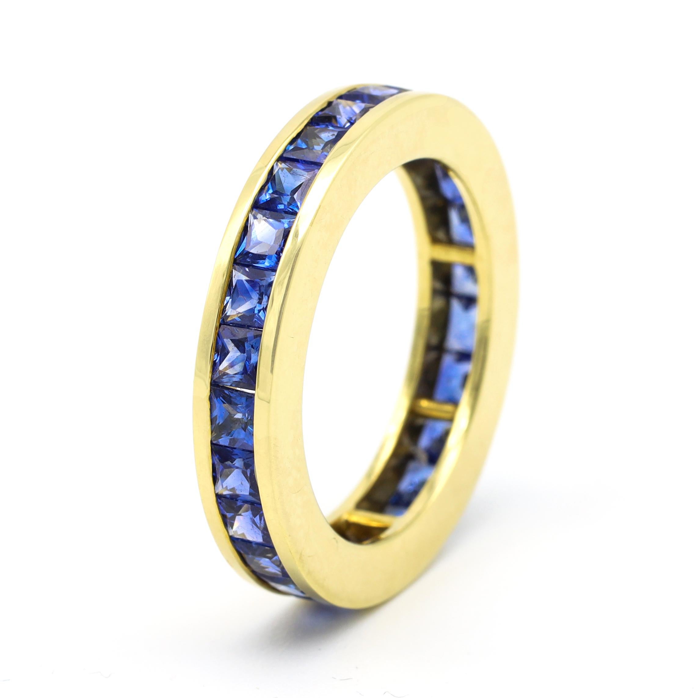18 Karat Yellow Gold 3.64 Carat Sapphire Princess-Cut Band Eternity Ring

This understated delicate azure princess-cut blue sapphire band is tasteful. The sapphires are princess-cut right to the crown to bring out the ultimate blue color each