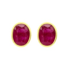 Clous d'oreilles en or jaune 18 carats et rubis taille ovale de 4,76 carats