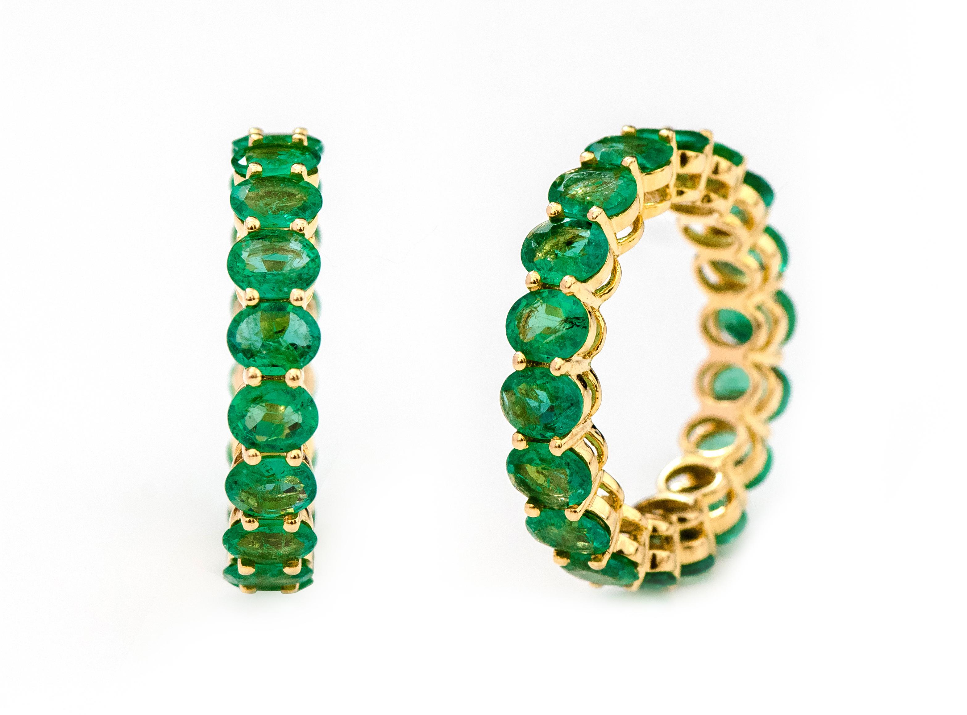 18 Karat Yellow Gold 4.78 Carat Oval-Cut Natural Emerald Eternity Band Ring

This glorious emerald band is sensational. The solitaire horizontally placed oval shape emeralds in grain prong yellow gold setting is timeless. The ideally cut, size, and