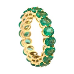 18 Karat Yellow Gold 4.78 Carat Oval-Cut Natural Emerald Eternity Band Ring