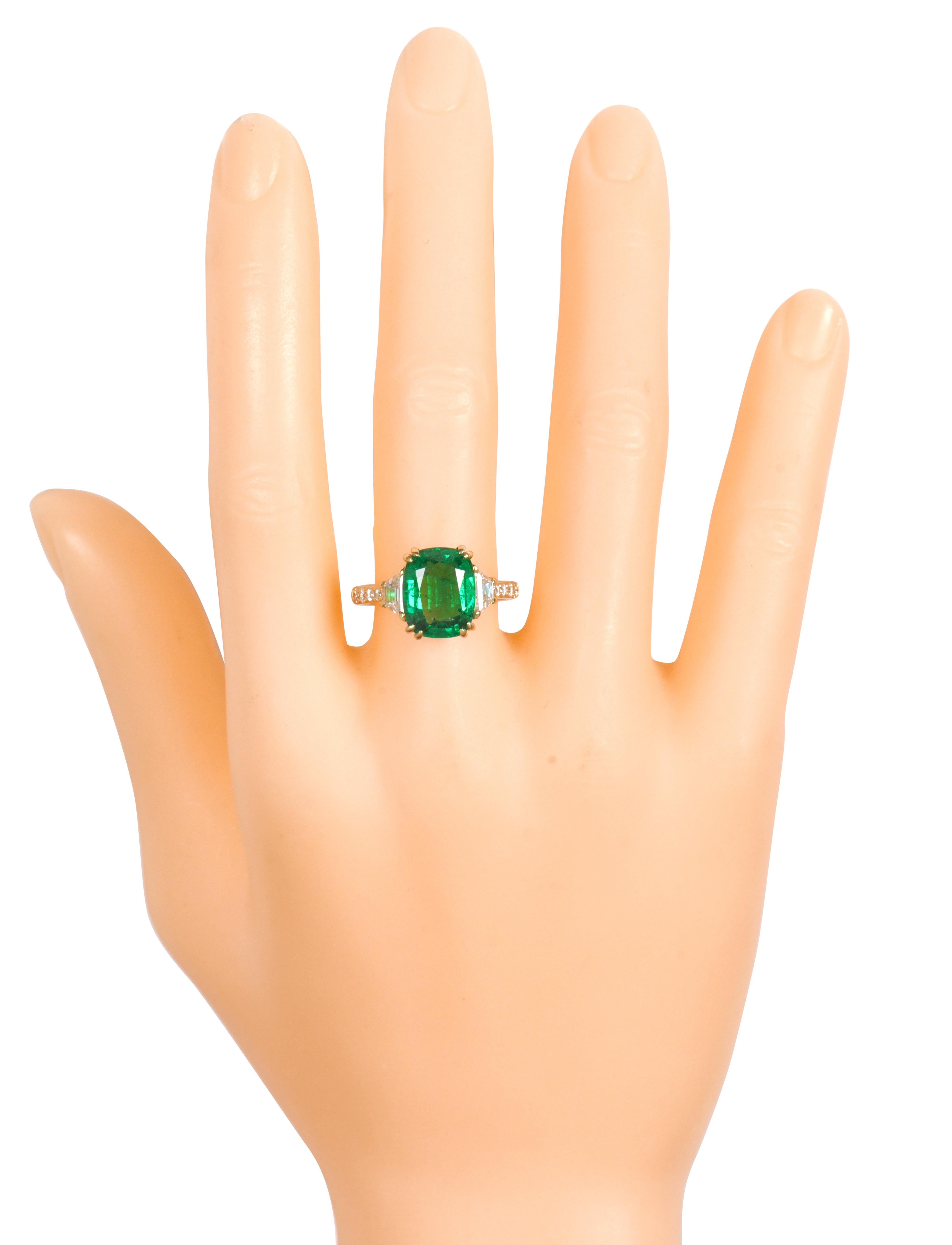 18 Karat Yellow Gold 5.06 Carat Natural Emerald and Diamond Solitaire Ring

This glorious trinity vivid green emerald and diamond ring is marvelous. The three-stone trinity ring tells a story by not only representing the said “past, present, and