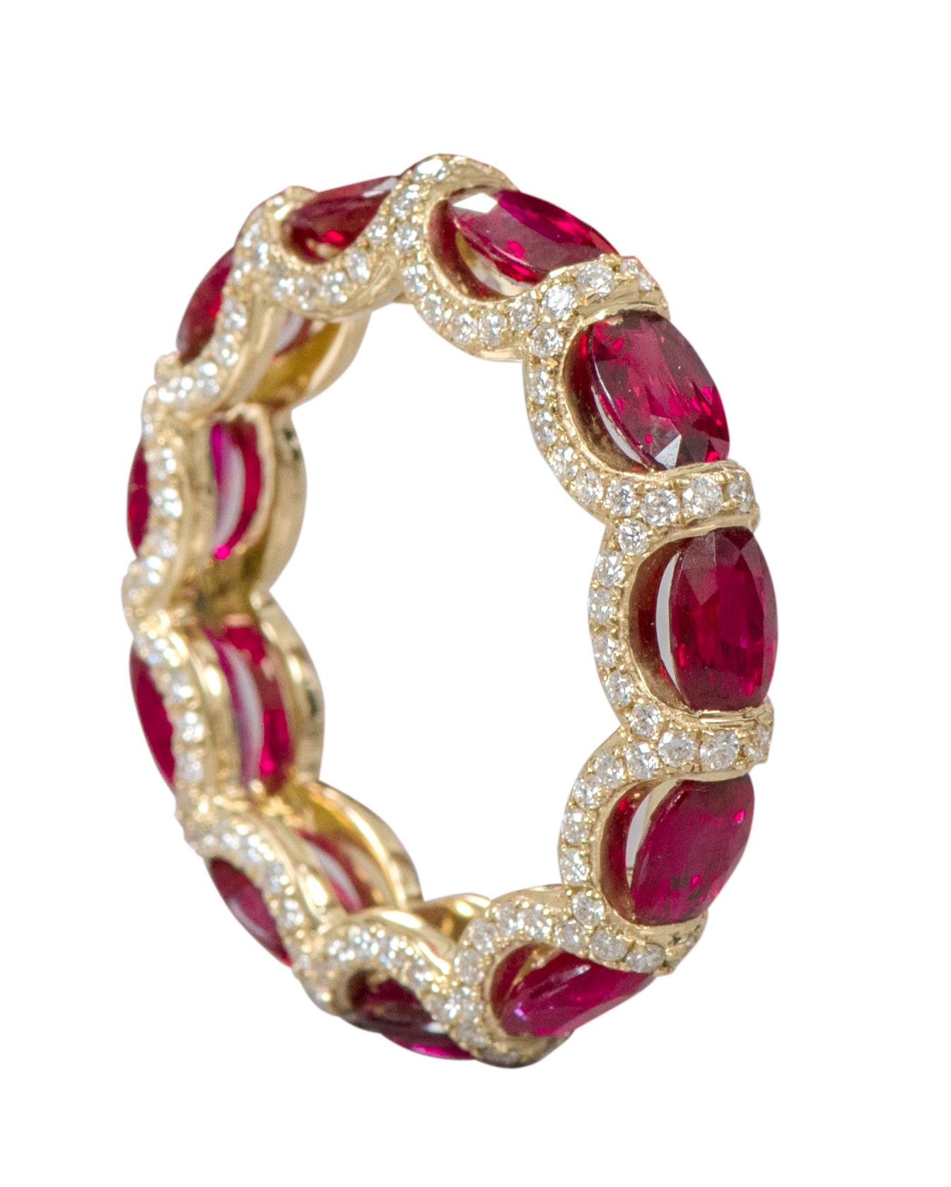 18 Karat Yellow Gold 6.40 Carat Ruby and Diamond Eternity Band Ring 

This glorious fiery red ruby and diamond band is phenomenal. The solitaire horizontally placed oval shape rubies are brilliantly enclosed in between pave set round diamonds
