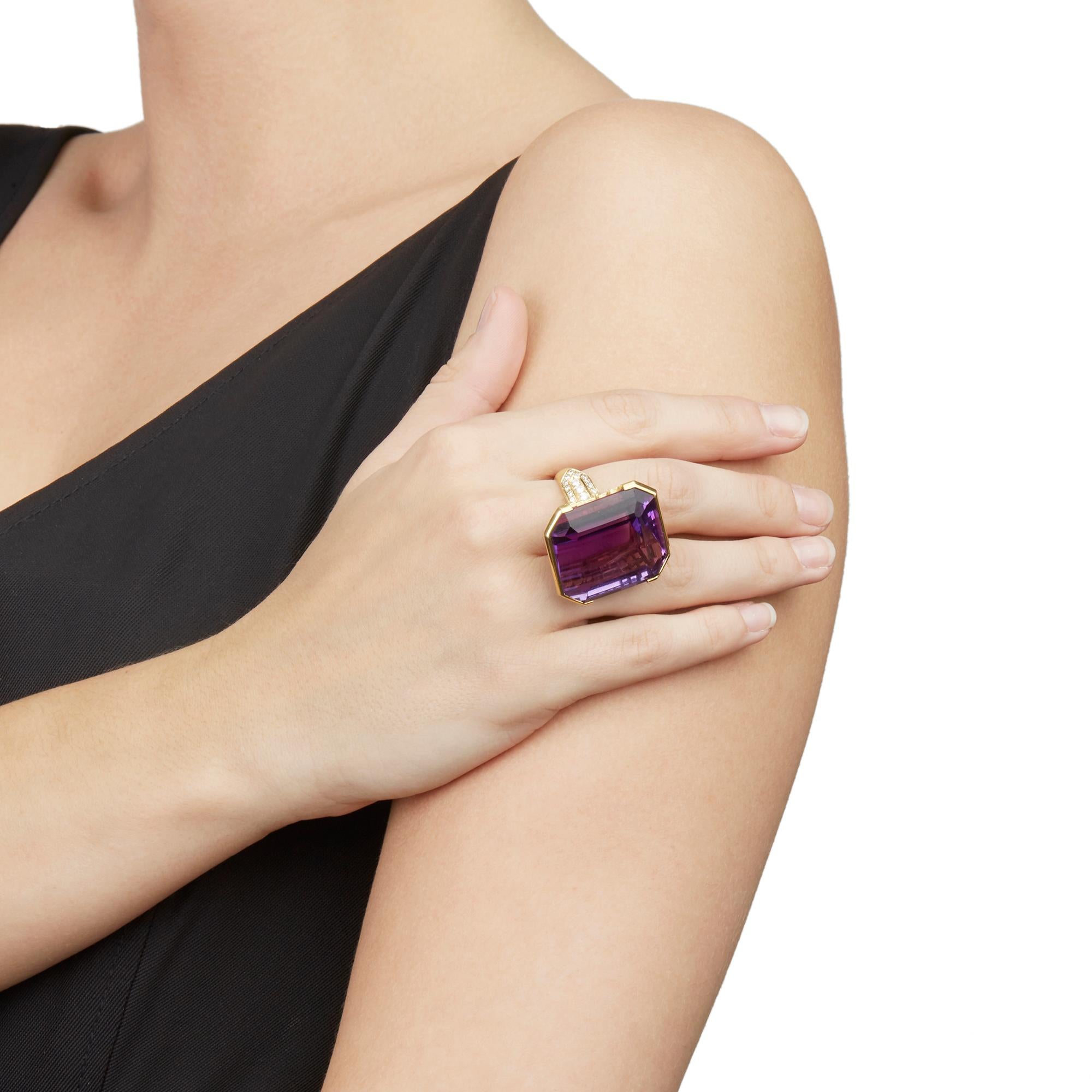 This Ring features an emerald cut Amethyst of 66.00ct with 28 round brilliant cut Diamonds of approximately 0.50ct total, made in 18k Yellow Gold. This Ring can be re-sized. Complete with Xupes Presentation Box. 
