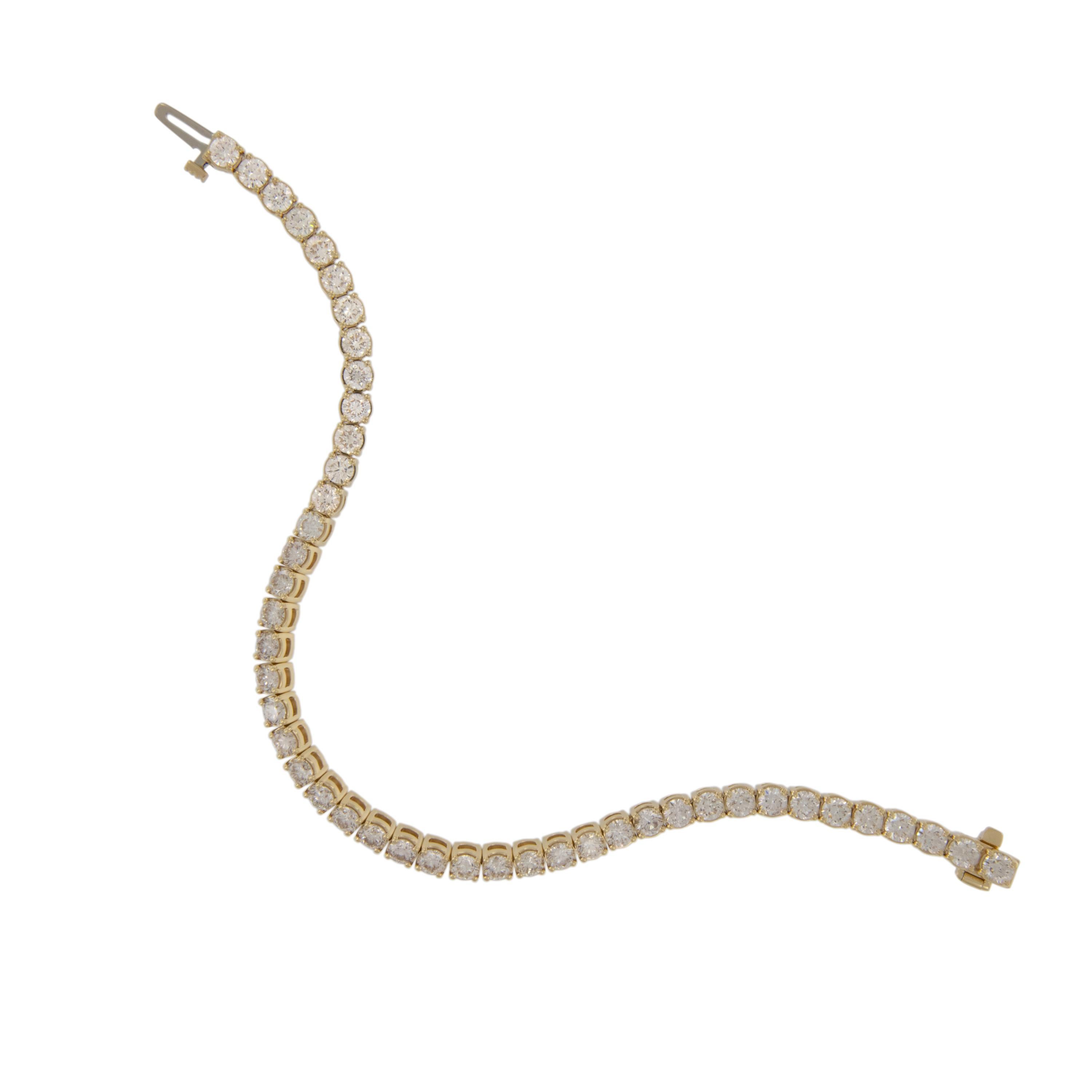 Worn on its own or stacked with other bangles, this piece is a staple in any jewelry collection. Made from rich 18 karat yellow gold and set with 45 RBC diamonds = 7.32 Cttw of VS, G - H quality this bracelet will feel just at home on your wrist
