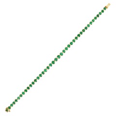 Bracciale tennis in oro giallo 18 carati con smeraldo da 8,27 carati con castone
