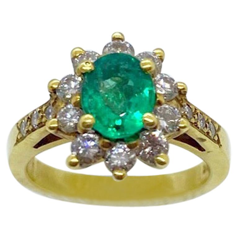 18 Karat Yellow Gold, .86 Carat Oval Emerald Ring with .75 Carat Diamonds For Sale