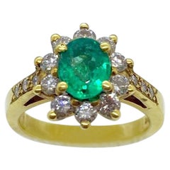 Vintage 18 Karat Yellow Gold, .86 Carat Oval Emerald Ring with .75 Carat Diamonds