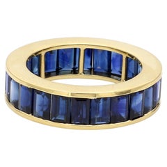 18 Karat Yellow Gold 8.95 Carat Emerald-Cut Sapphire Eternity Band Ring