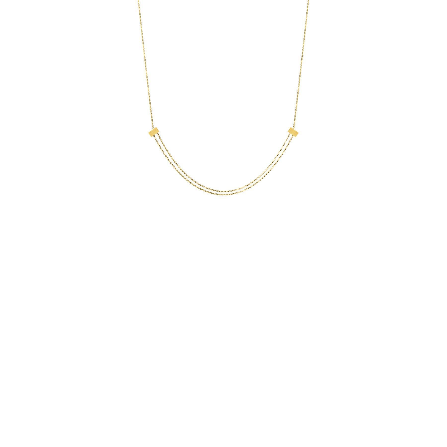 A necklace with two adjustable rectangle cubes. The cubes can be moved along the chain for various styling and length possibilities.

18 Karat Yellow Gold Adjustable Cube Necklace
Chain length: 800mm
Single cube diameter: 3.6mm x 6.24mm x