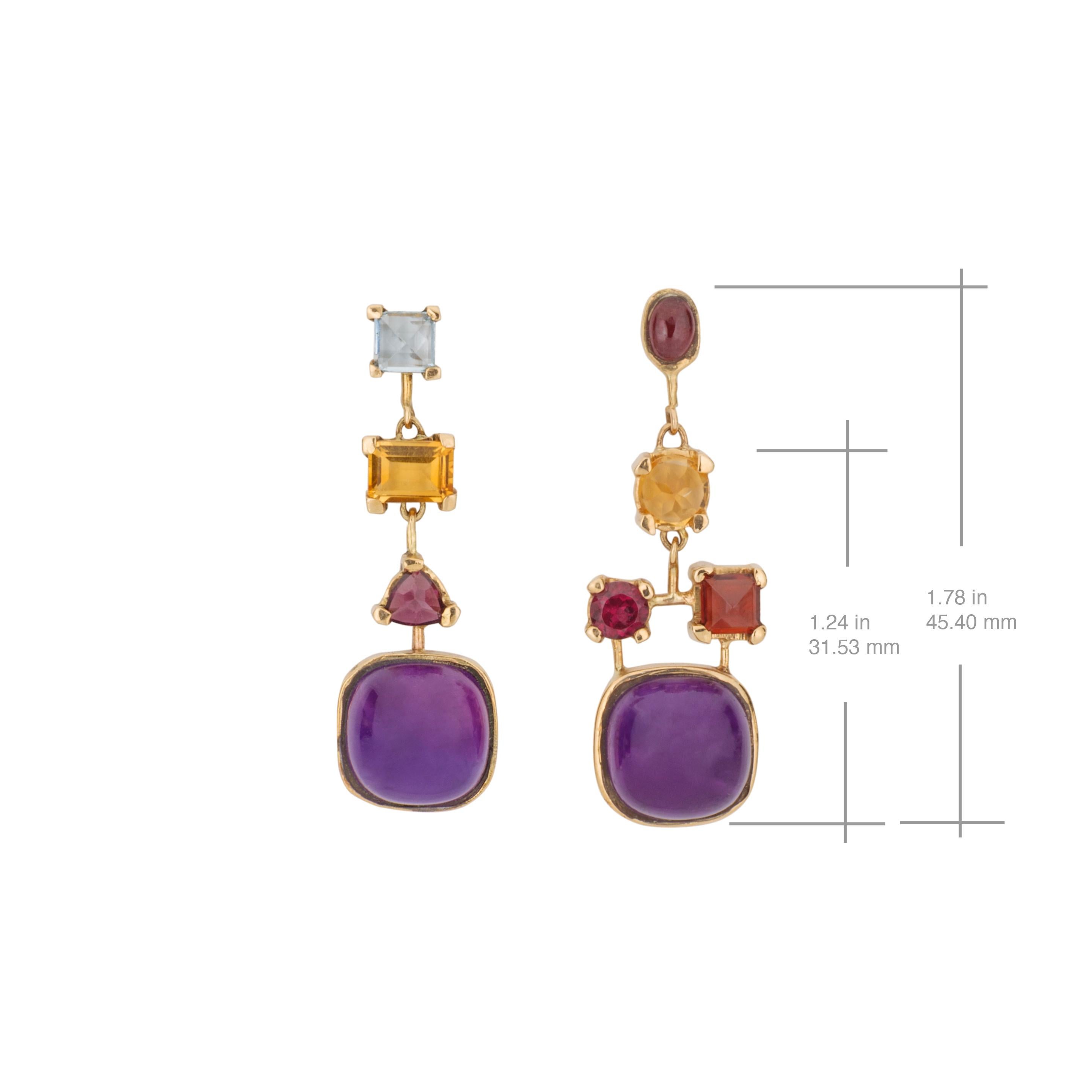 This contemporary multi gemstone asymmetrical 18 karat yellow gold dangle earrings, combine Amethyst, Yellow and blue Topaz and Garnet on an unexpected geometrical way. The main focus of these earrings is the Amethysts. The designers wanted to