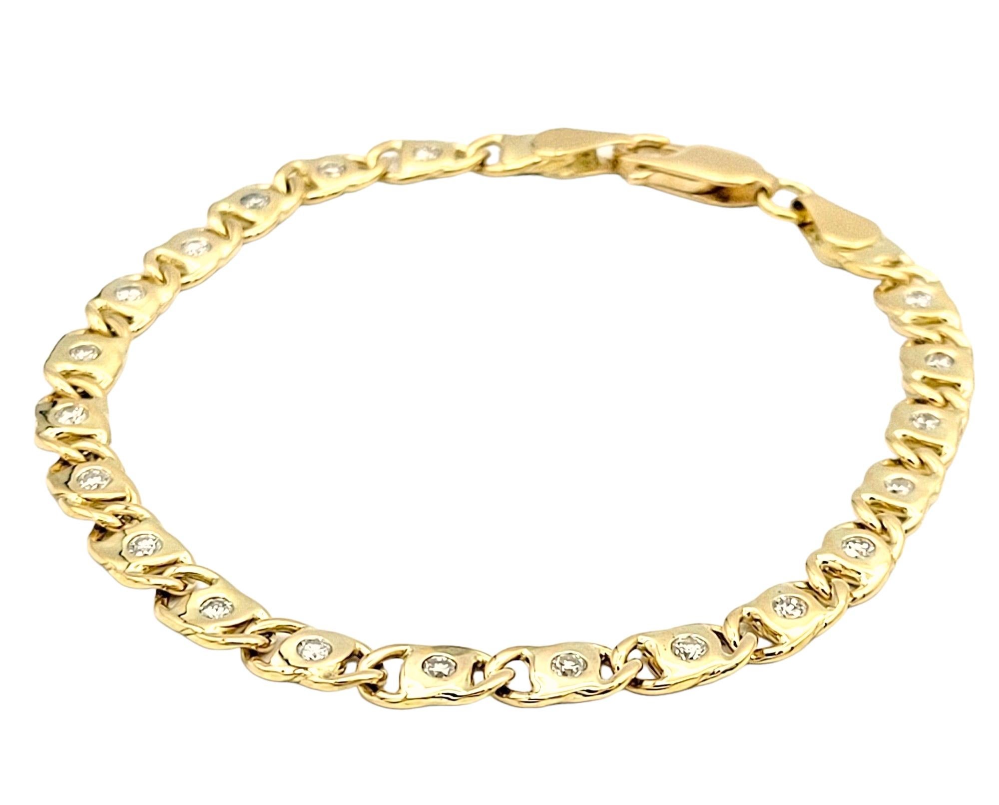 Length: 7.5 Inches

Shown here is a gorgeous 18 karat yellow gold anchor link chain bracelet adorned with 1.00 carat of natural round diamonds. This captivating piece seamlessly blends elegance and style, offering a luxurious accessory for any