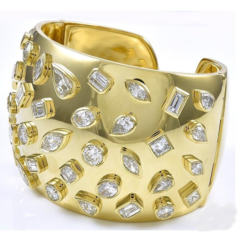 Sophia D. 18 Karat yellow gold bangle that consists of thirty nine single diamonds with the total weight of 24.43 carats.  

Sophia D by Joseph Dardashti LTD has been known worldwide for 35 years and are inspired by classic Art Deco design that