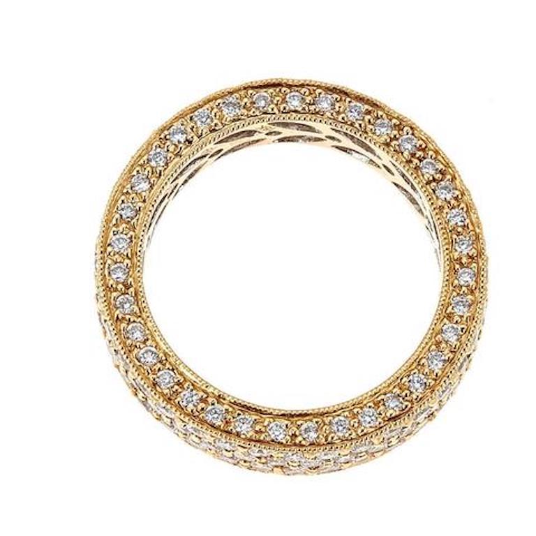 3.2 Carat White Diamond Pave Filigree Eternity Band in 18K Solid Yellow Gold Size 6.75

This luxurious eternity band features three rows of pave shining white diamonds edged by intricate filigree engraving. The opulent finish with pave diamonds on